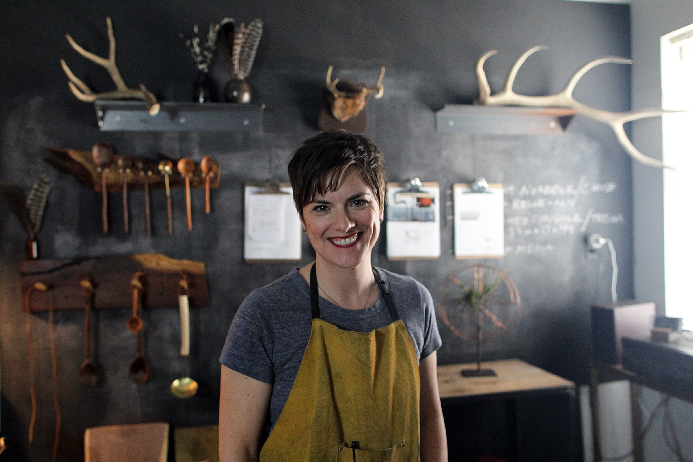  Local welder and furniture-maker Pam Hodnefield poses for a photo in her shop. 