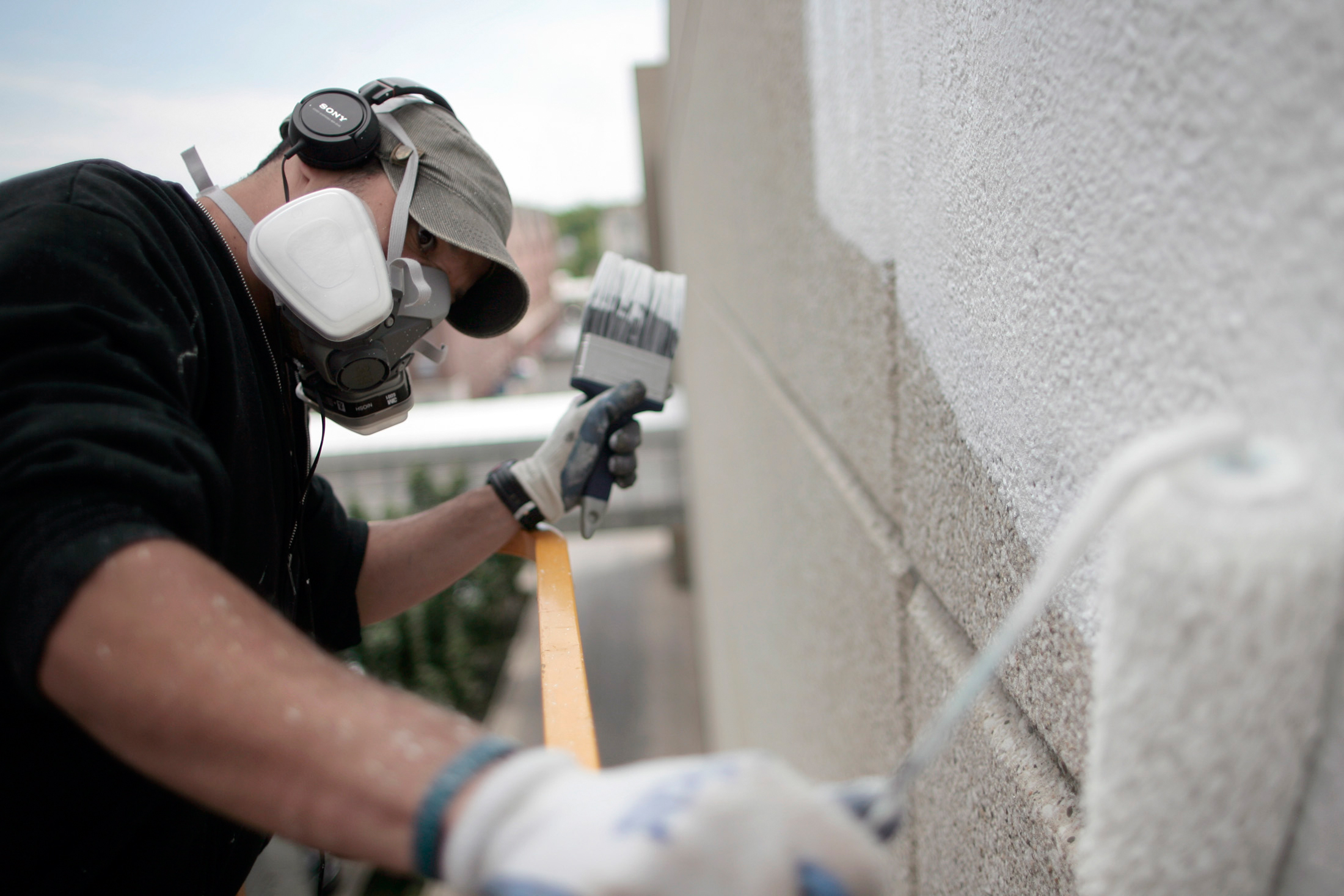  UI graduate Ely Sotillo begins working on his 4,300-square-foot mural. 