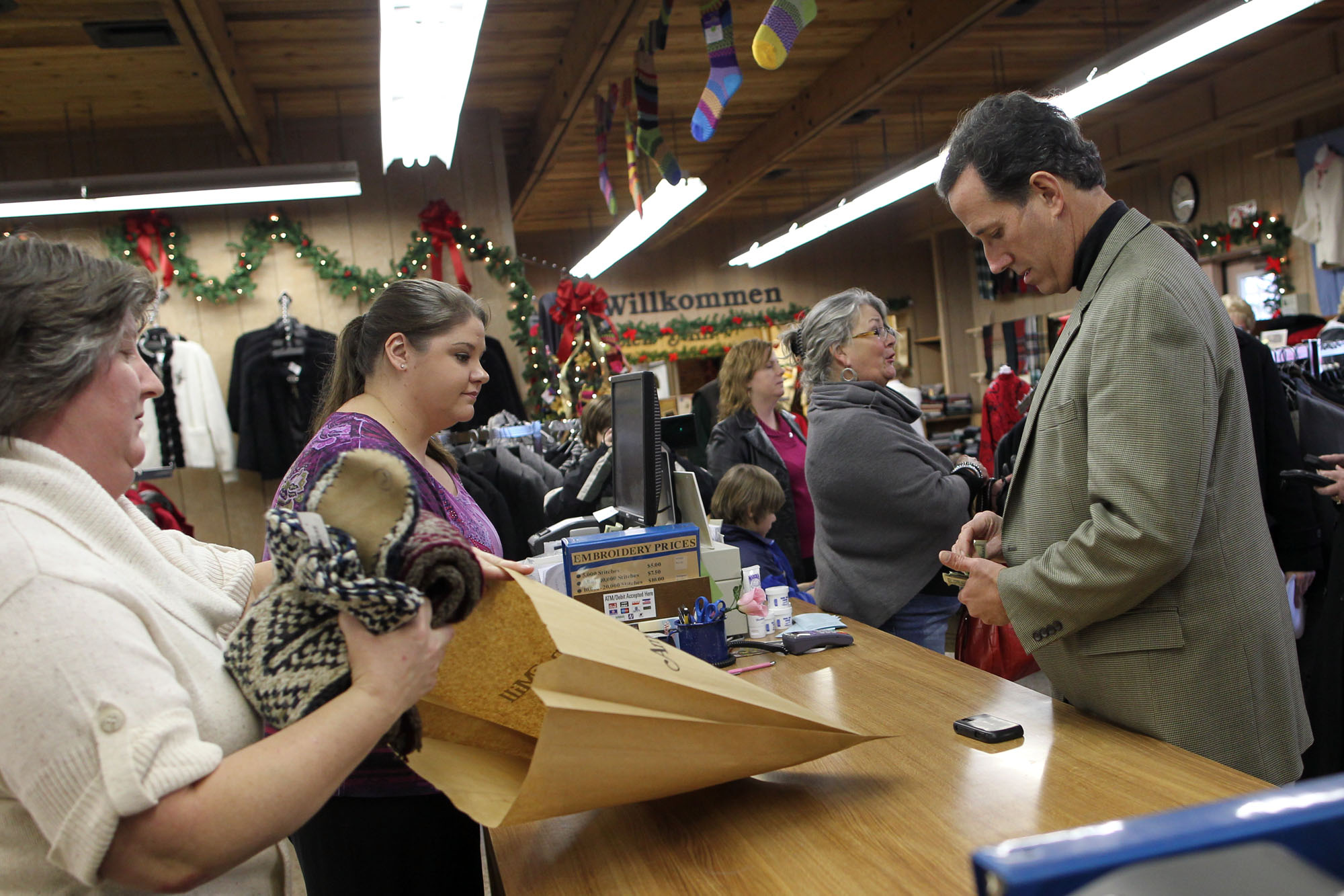Republican presidential candidate Rick Santorum shops for Christmas gifts for his family in Amana.