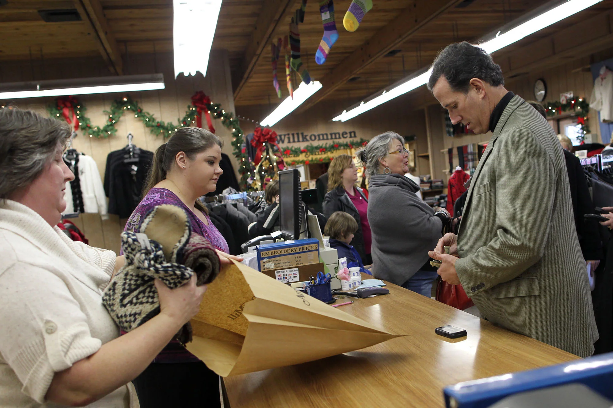 Republican presidential candidate Rick Santorum shops for Christmas gifts for his family in Amana.