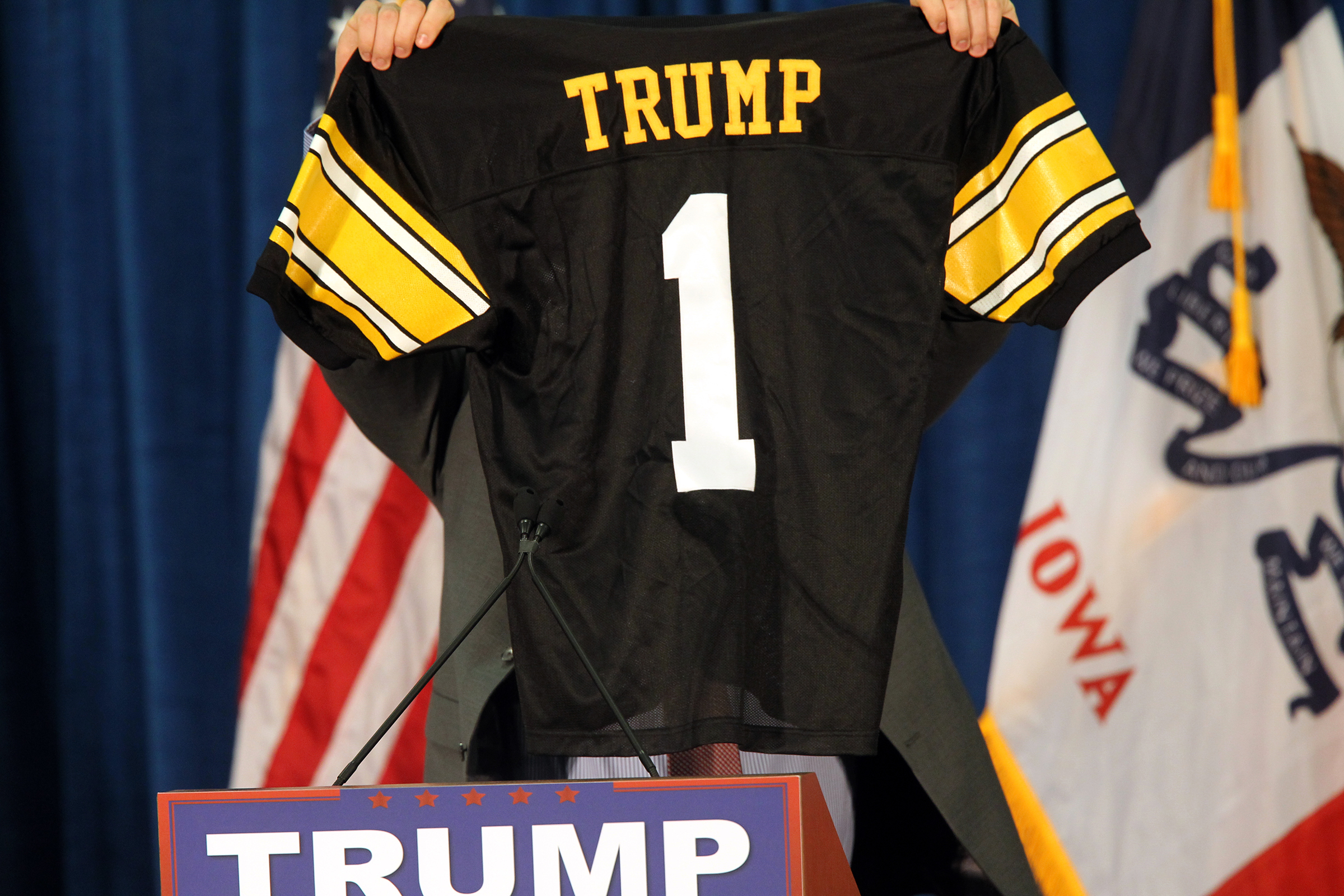 Iowa tight end Peter Pekar displays a personalized jersey for Republican presidential candidate Donald Trump at the UI Field House.