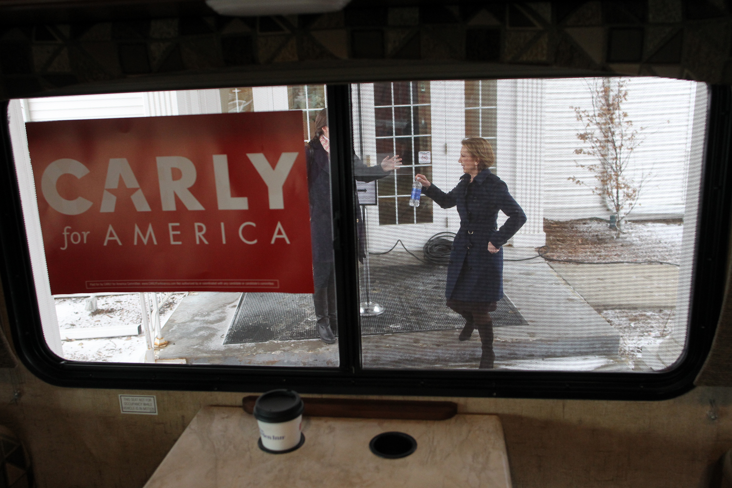 Republican presidential candidate Carly Fiorina heads to her campaign bus following a town hall meeting in Iowa City.
