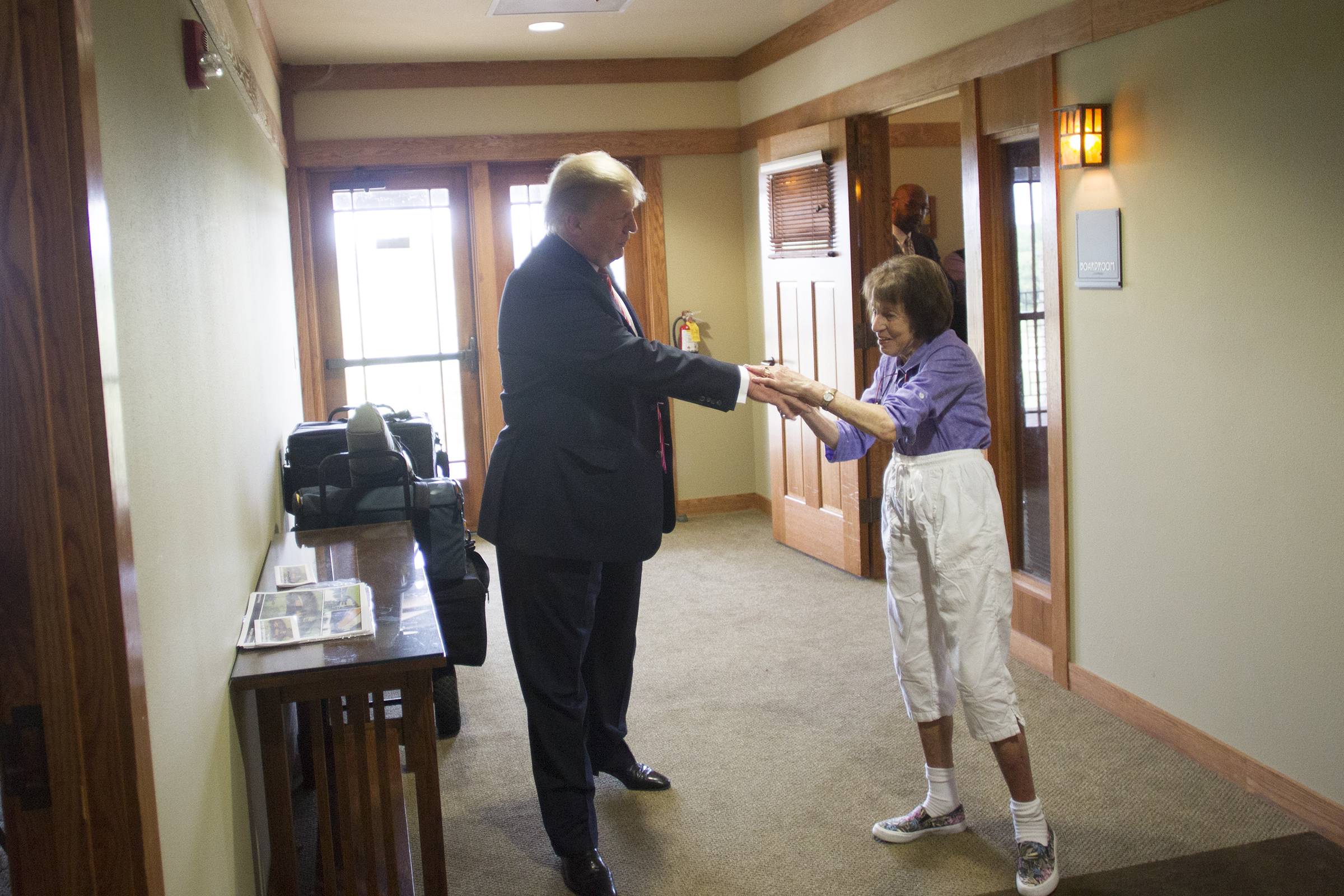 Donald Trump greets a guest at Brown Deer Golf Course, days before announcing his candidacy for President of the United States.