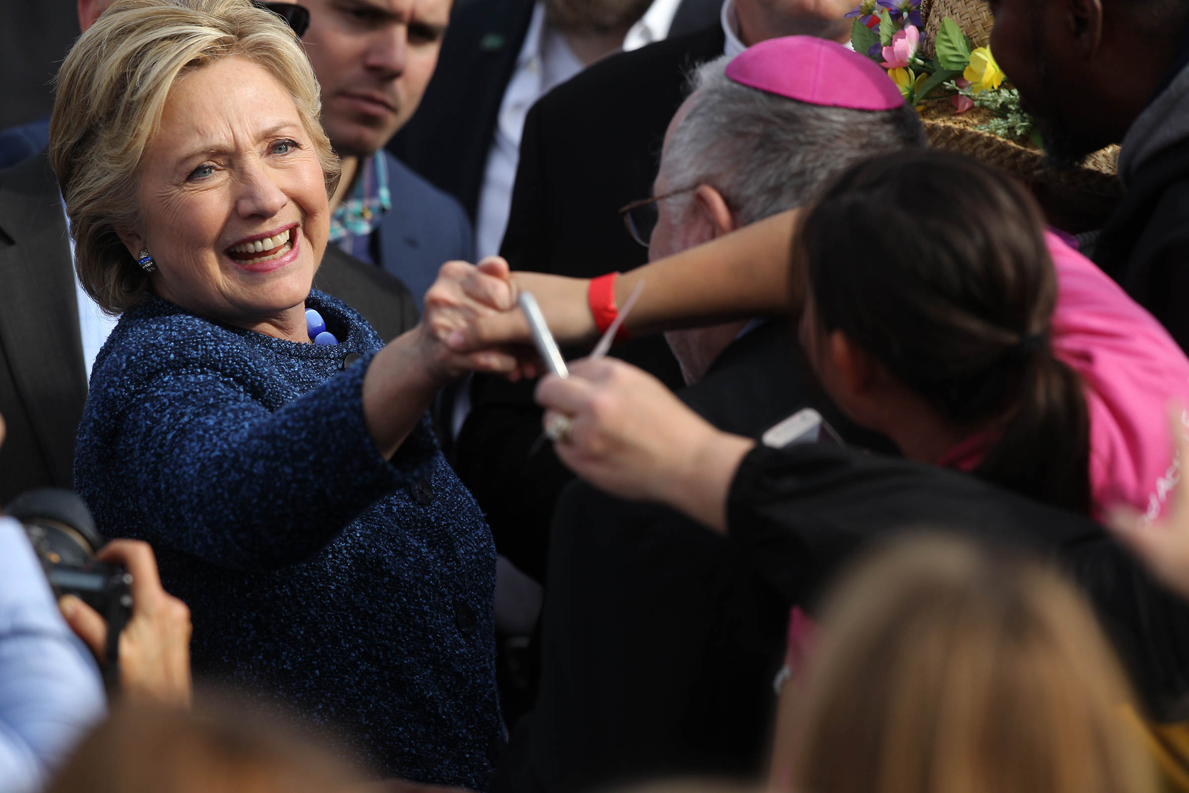 Democratic presidential candidate Hillary Clinton greets guests following her speech outside the NewBo City Market.