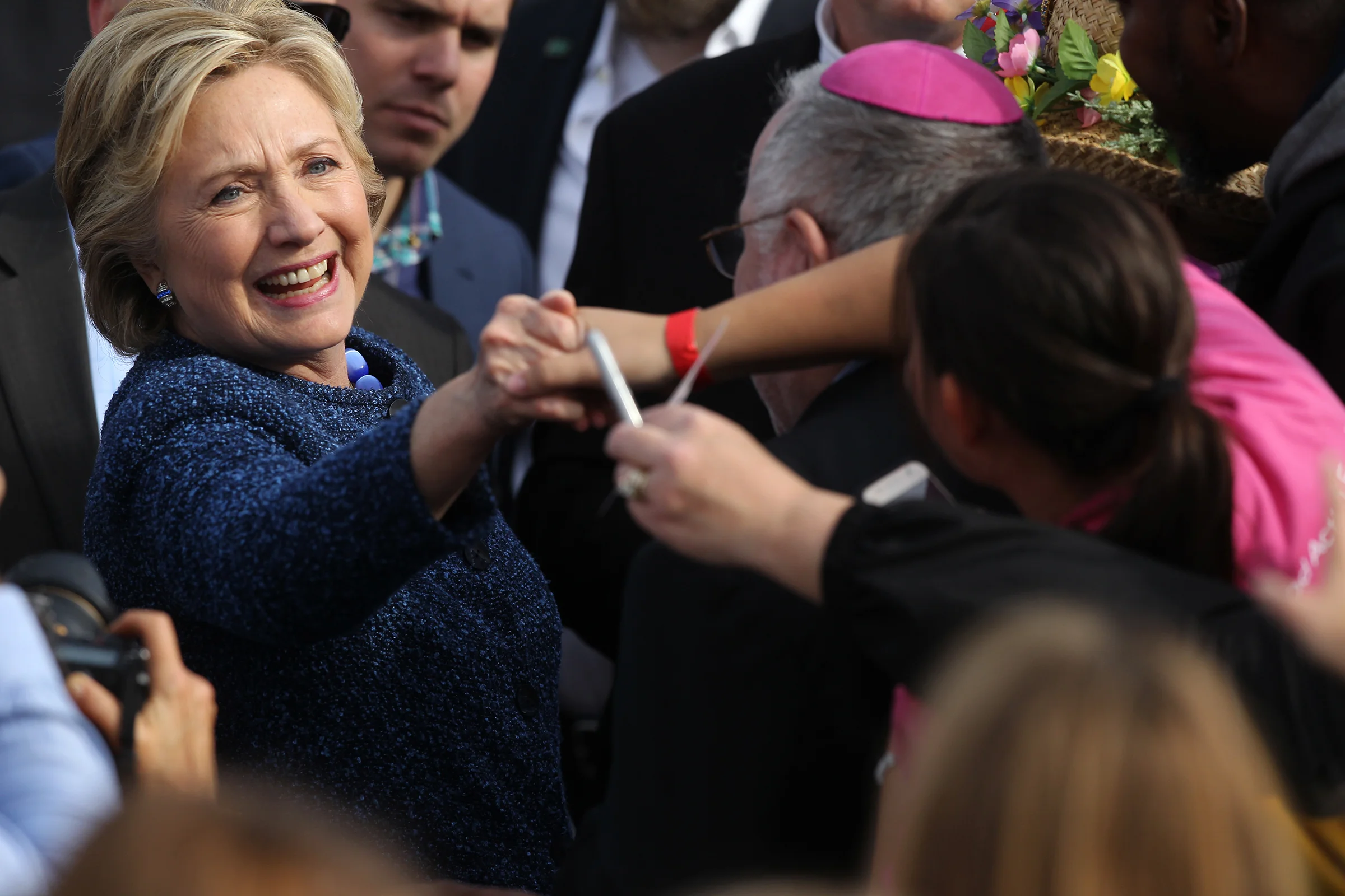 Democratic presidential candidate Hillary Clinton greets guests following her speech outside the NewBo City Market.