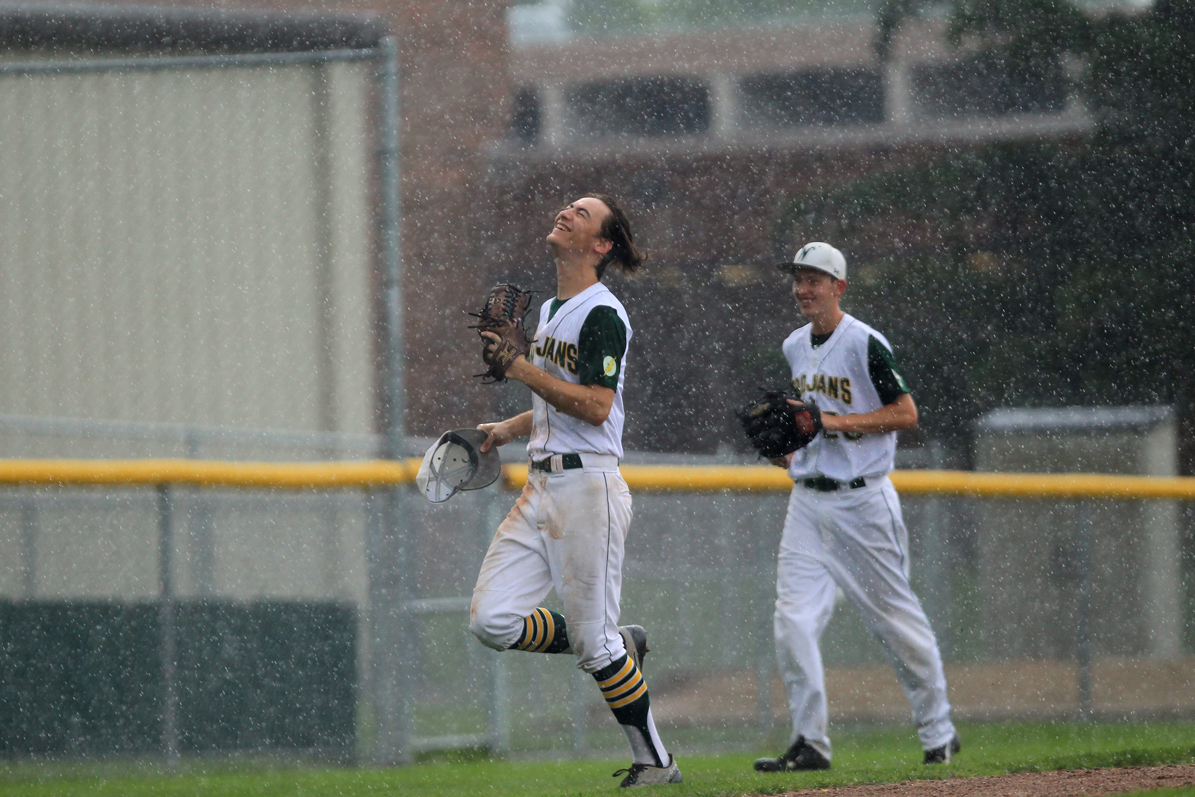  West High's Kevin DeLaney embraces the rain as the Trojans' game against Waterloo East gets postponed until another day. 