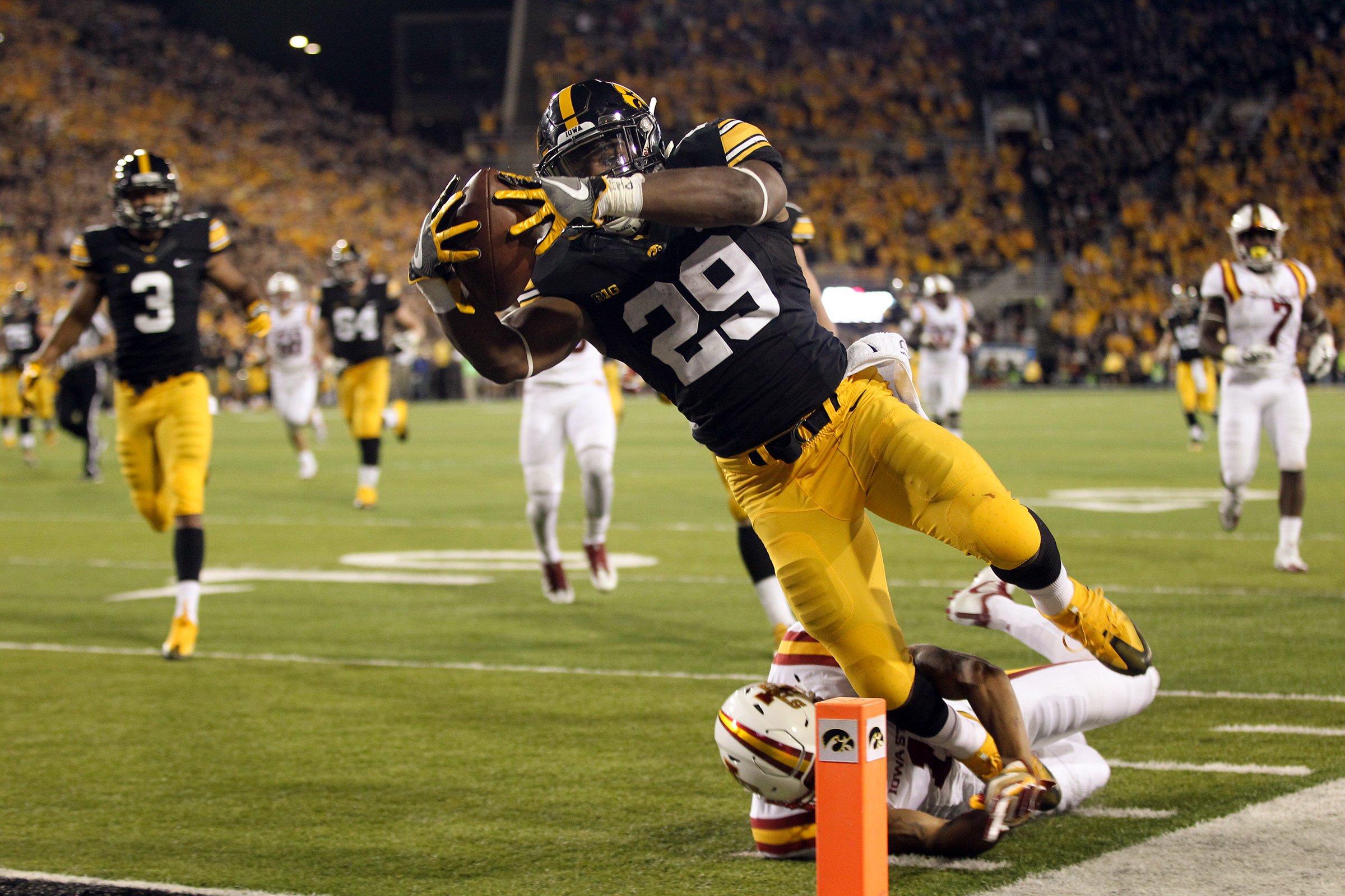  Iowa's LeShun Daniels, Jr. dives in for a touchdown during the Hawkeyes' game against Iowa State at Kinnick Stadium. 