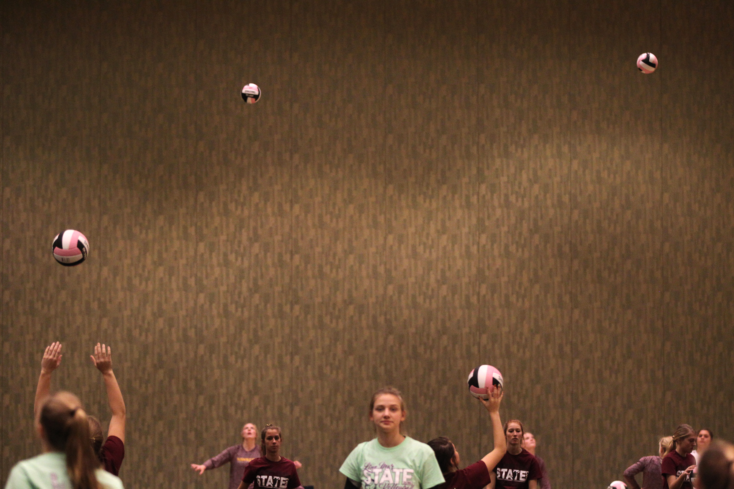  Players warm up for their matches at the Iowa State Volleyball Tournament in Cedar Rapids. 