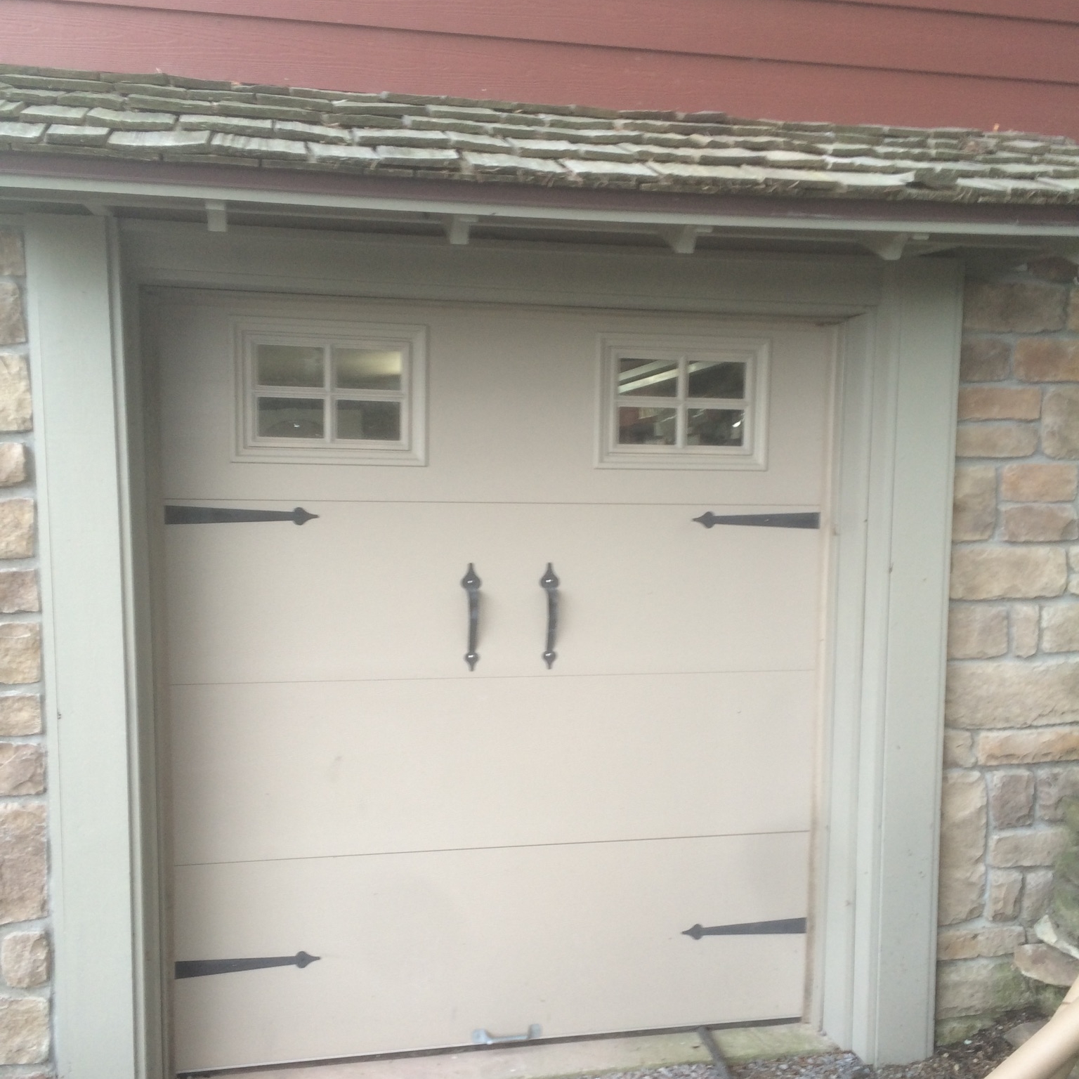 This was our "garage" door before we started. To say it was a garage wasn't really true. I doubt we could have fit anything larger than a Smart Car through this tiny thing.