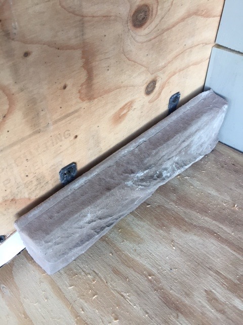 These crazy things let you attach the stone using screws. No messing with mortar. It was really weird to screw in pieces of stone with the drill. 