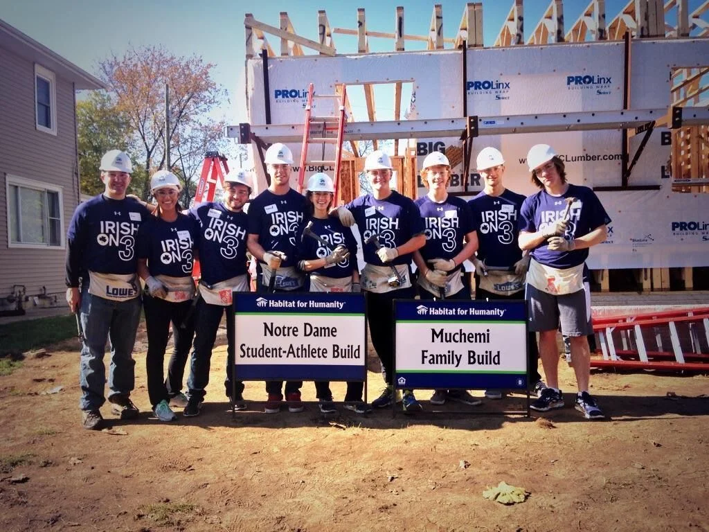 2014-15 For the 2014-2015 academic year, SAAC partnered with Habitat for Humanity of St. Joseph County to build a new home for the local Muchemi family. On the first day of the build, student-athletes built the walls and frames of the house. Habitat then transported the frame of the house to the build site, where they will be volunteering throughout the fall and spring semesters in groups of about 15. For more photos of the SAAC Habitat for Humanity build, click