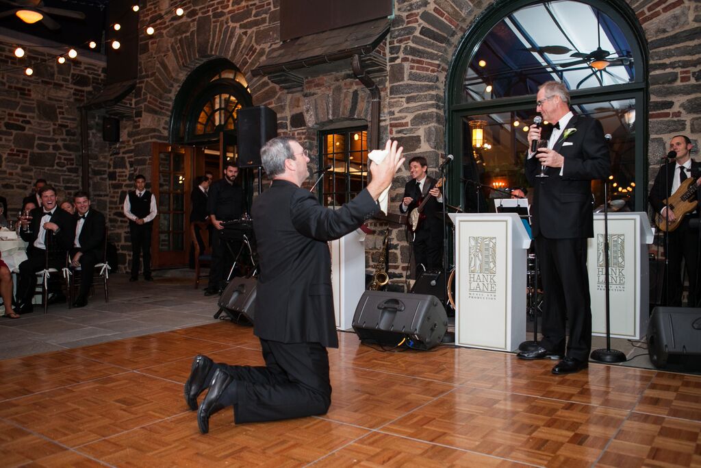 Quite possibly the best picture: Father Tom on his knees before my dad AKA Bruce after his epic vocal performance