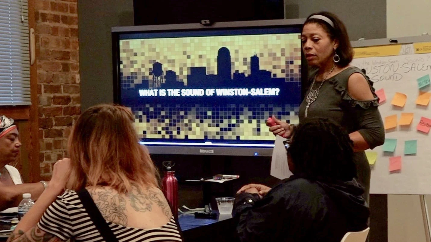Carol Andrews facilitates a group of musicians to explore the local Winston-Salem scene.