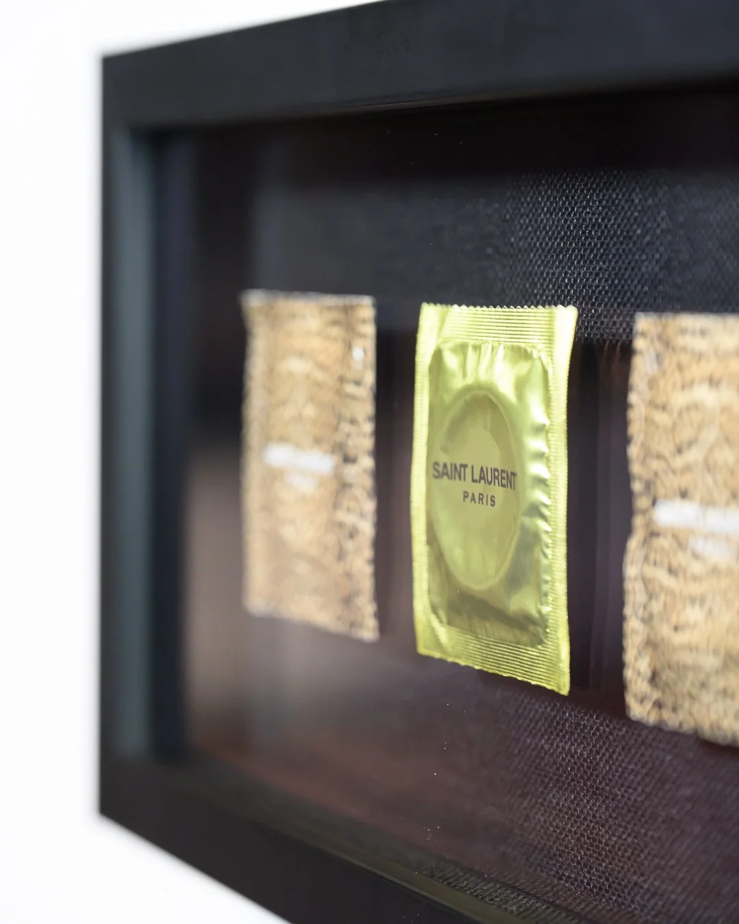 saint laurent condoms framed in black shadowbox-87707.jpg