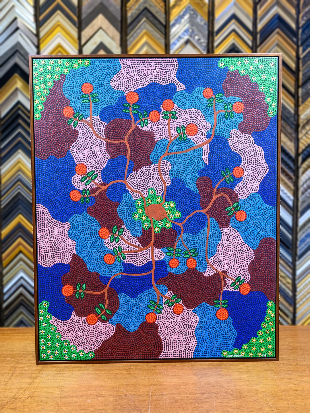  Original contemporary canvas painting framed in a rich brown floater frame at a San Francisco custom frame shop, showcasing earthy tones and museum-quality framing 