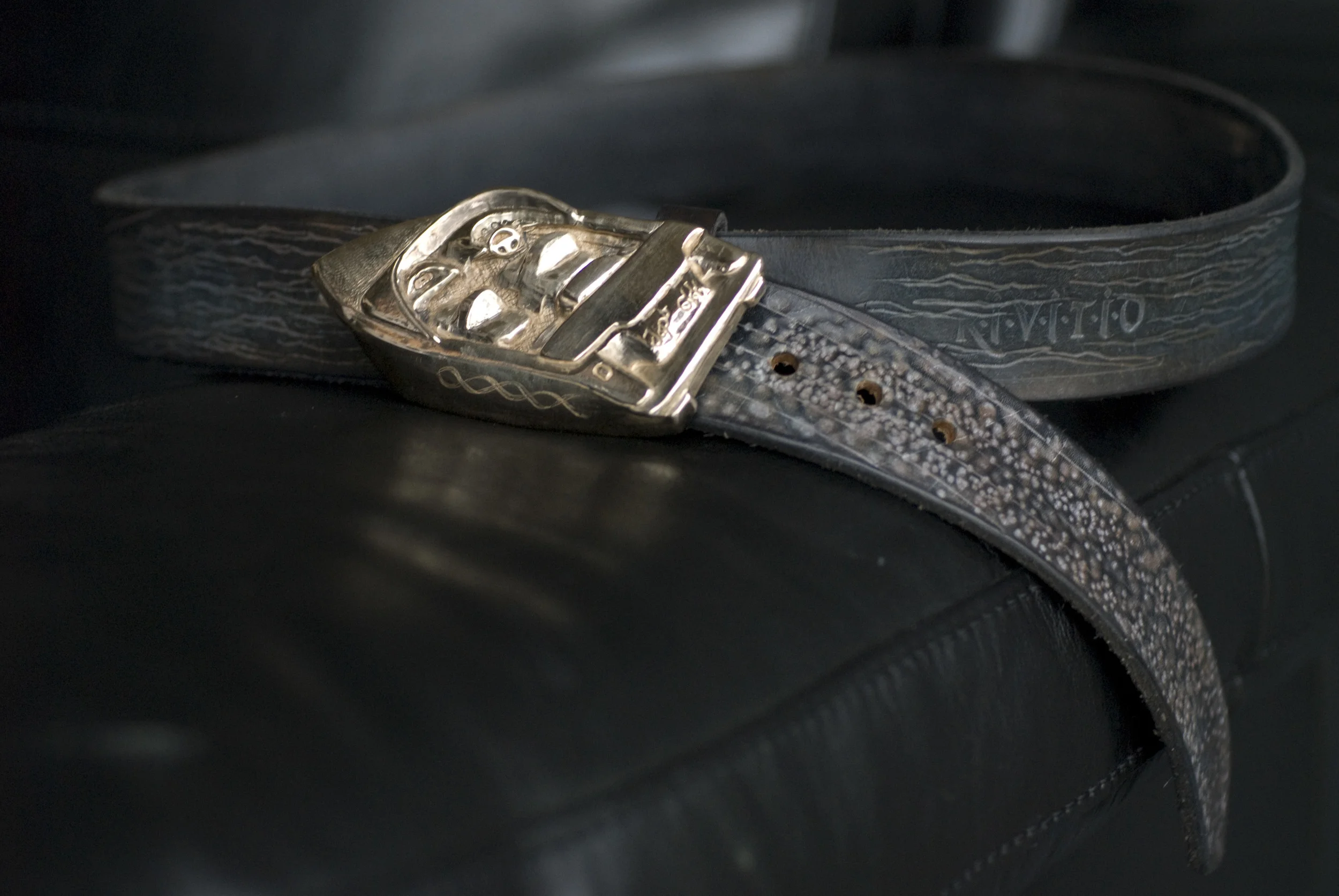 Hand carved, cast belt buckle