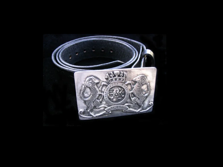 Hand carved, cast belt buckle.