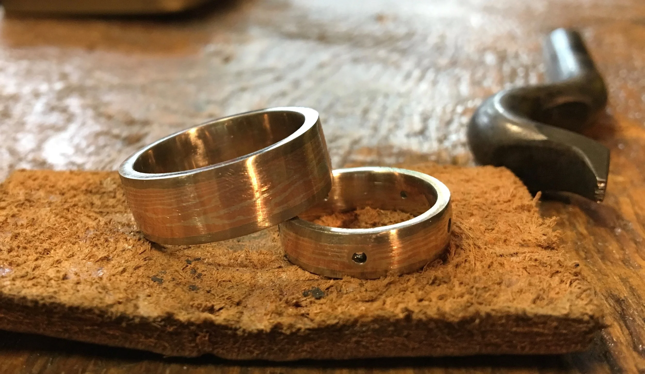 In this view the outside has been filed and sanded and is ready for polishing. You can see my DuKo stamp for hammering my name inside the rings....