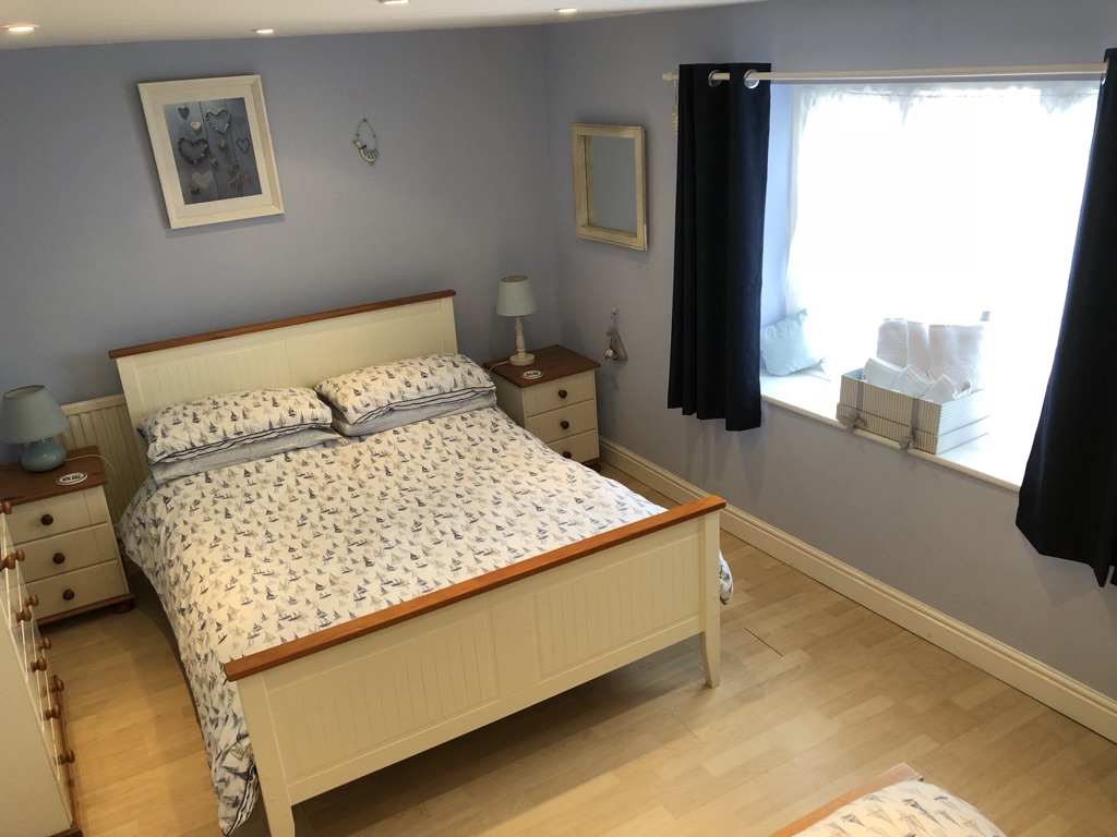 Bedroom 1 - Double bed, single bed, wardrobe, chest of drawers, chair, lamps, dimmer lights Access to Bathroom with bath, sink and WC.