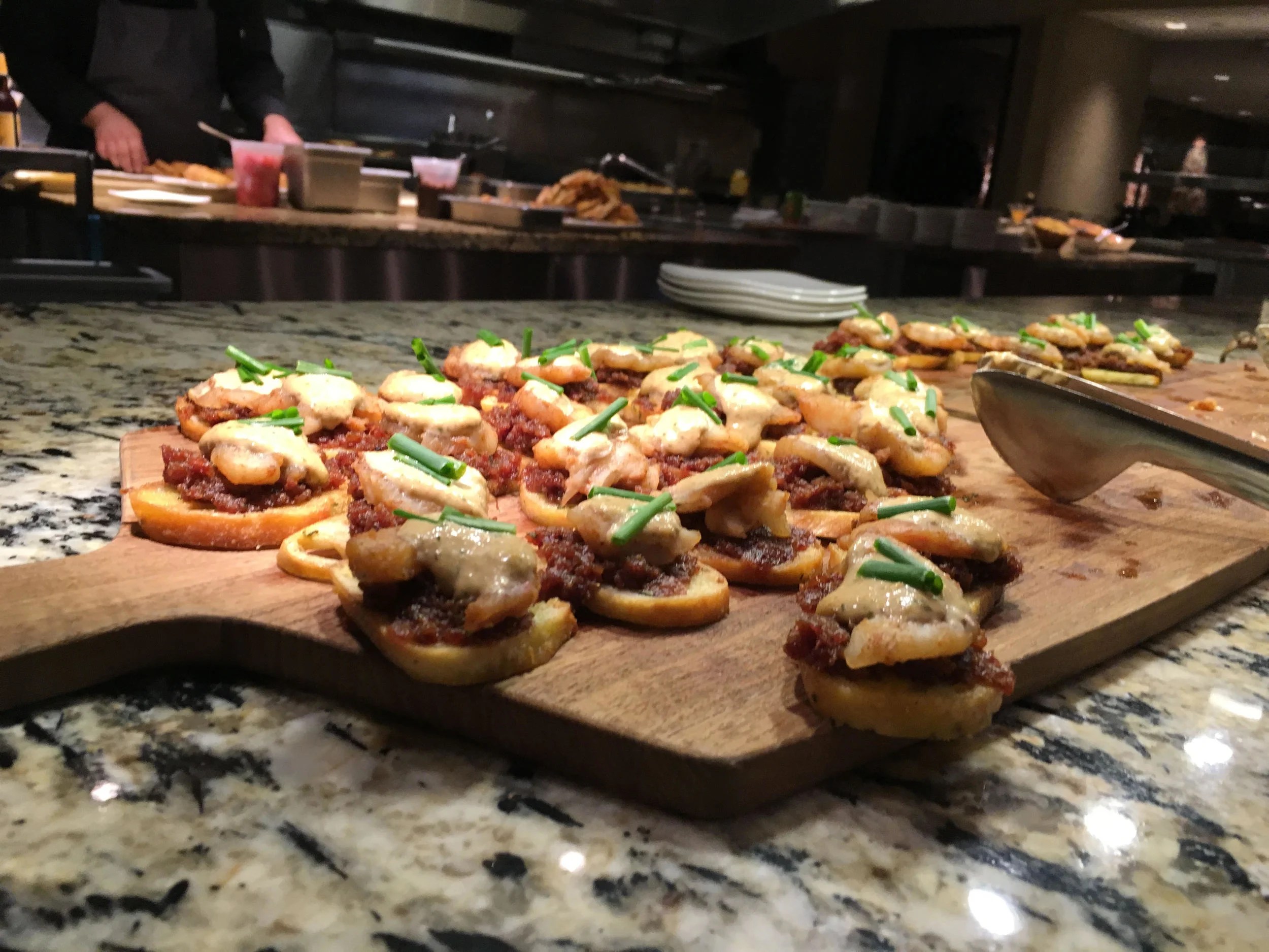 Smoked Louisiana Shrimp with Bacon Onion Marmalade, and Pickled Red Onions on a Bruschetta.