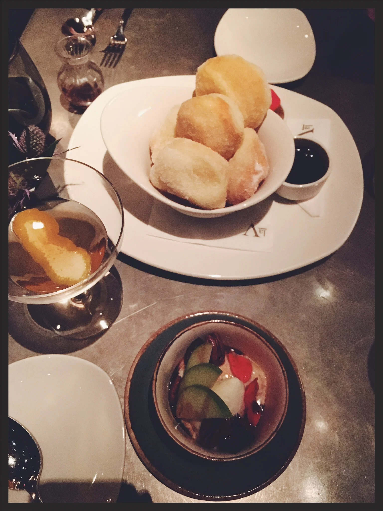 From Top: Warm Brioche Doughnuts, coffee pastry cream, fudge sauce and below, Blue Cheese Ice Cream, candied pecans, port figs. 
