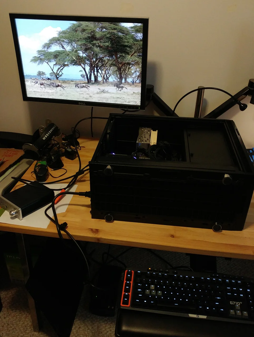 Putting my giant heatsink back in, along with the graphics cards and hard drives (shipped separately).
