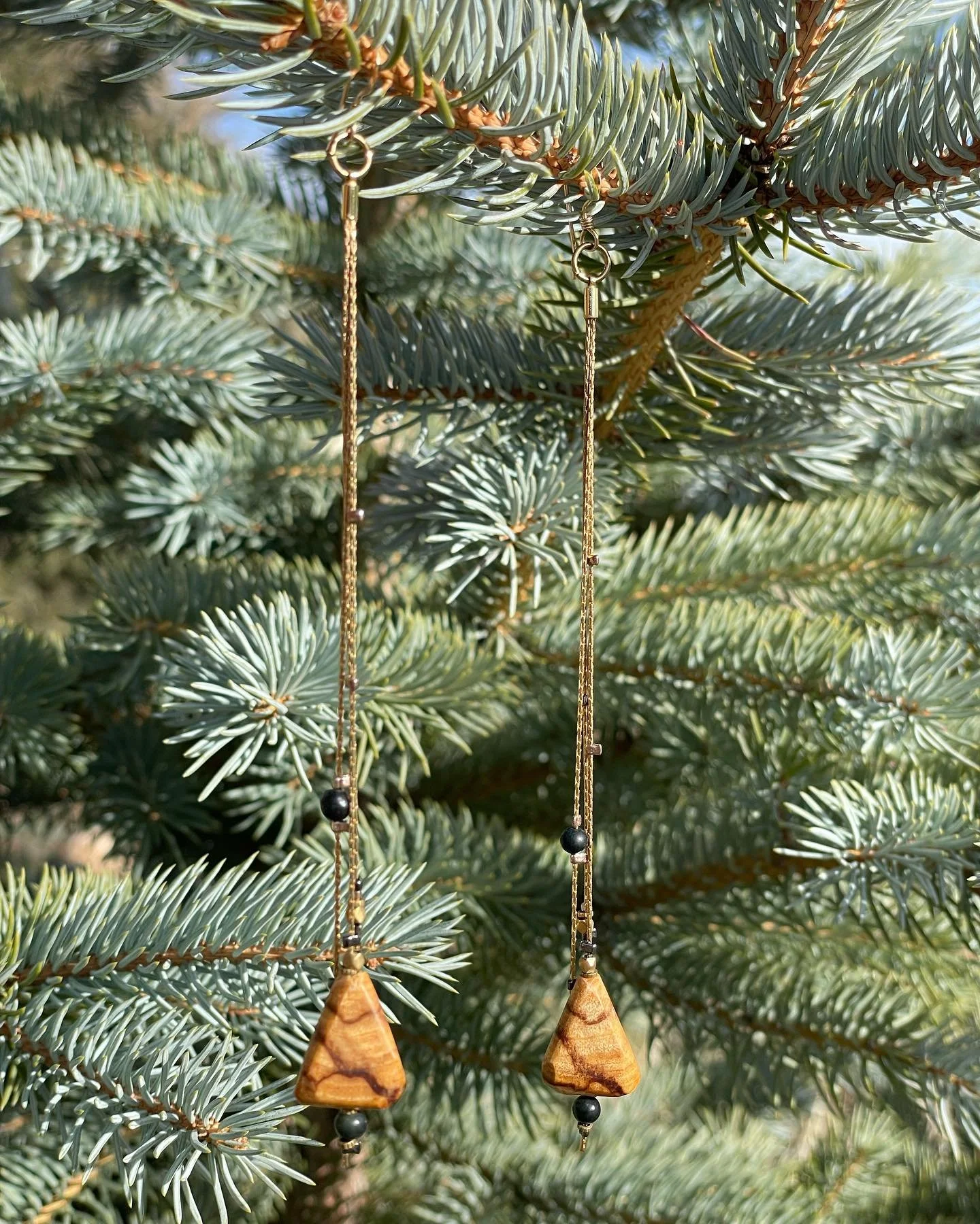 Palo Santo, Jade &amp; Brass
&bull;~&bull; &bull;~&bull; &bull;~&bull; &bull;~&bull; &bull;~&bull; &bull;~&bull; &bull;~&bull;
The woman who bought these asked me to shorten them - and I really loved the shorter length on her once I did!

They remain