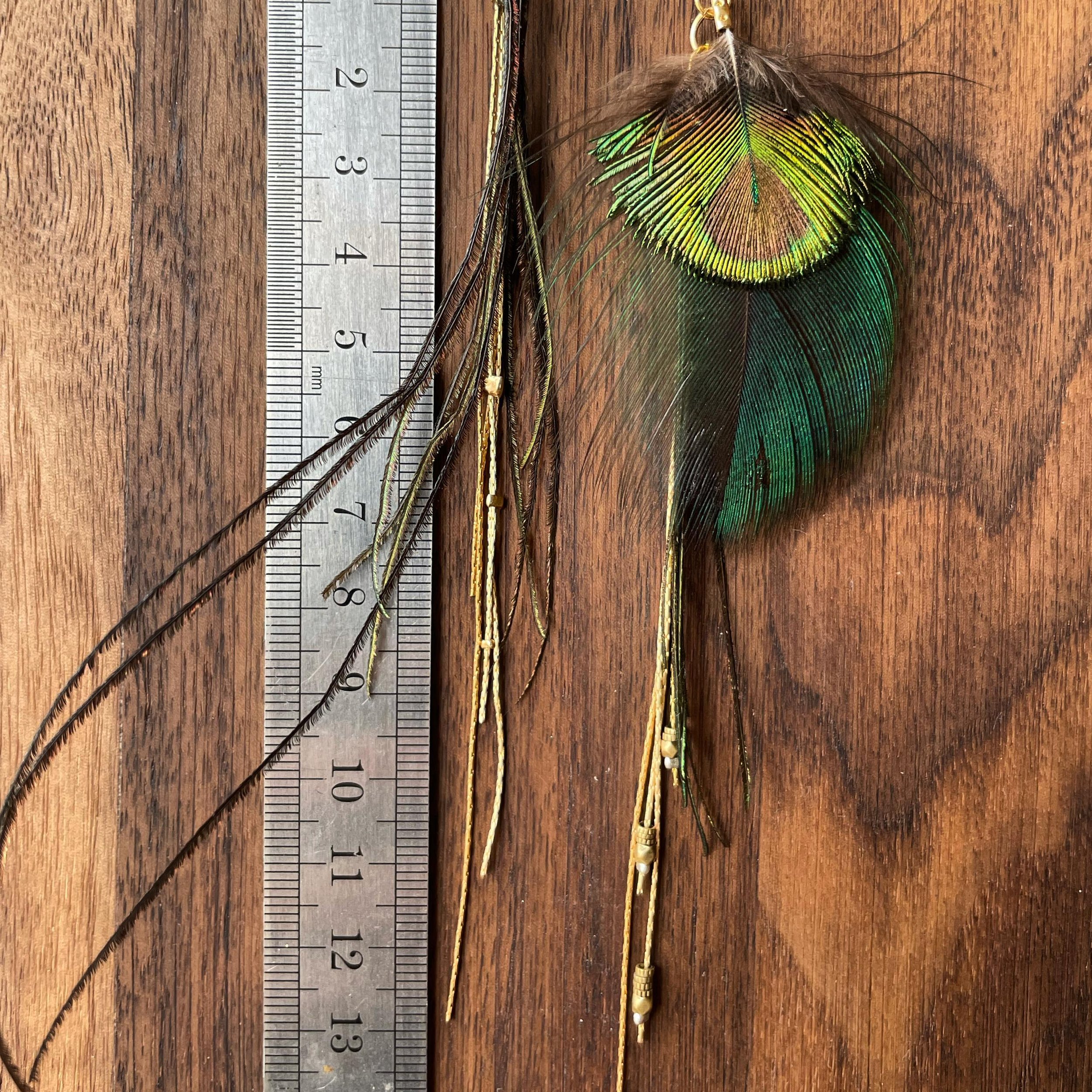 Throwback :: Close Up ::
Peacock Feather Bundle, Brass Bead, &amp; Gold Chain Earrings :: on one of my favorite Walnut Cutting boards I made. 
:: || ::
I am getting ready to start on a project that has a lot of Peacock elements to it.
Looking forward
