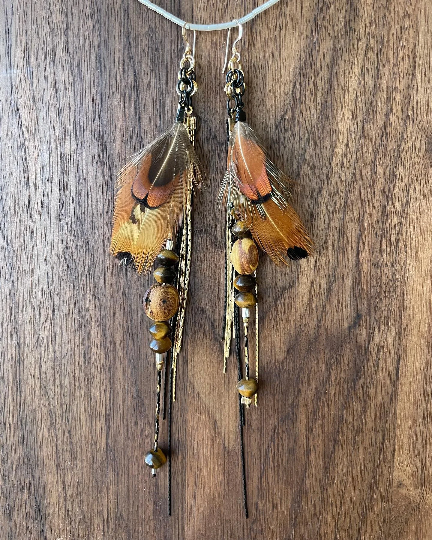 &ldquo;Big Cat Speaks&rdquo;
Pheasant feather bundle, Tiger Eye Gemstone, Palo Santo Wood
&bull;
I am in joy making earrings these days. 
As a teenager, I would wear a different pair.
every.
day.
Earrings are some of my favorite types of body adornme