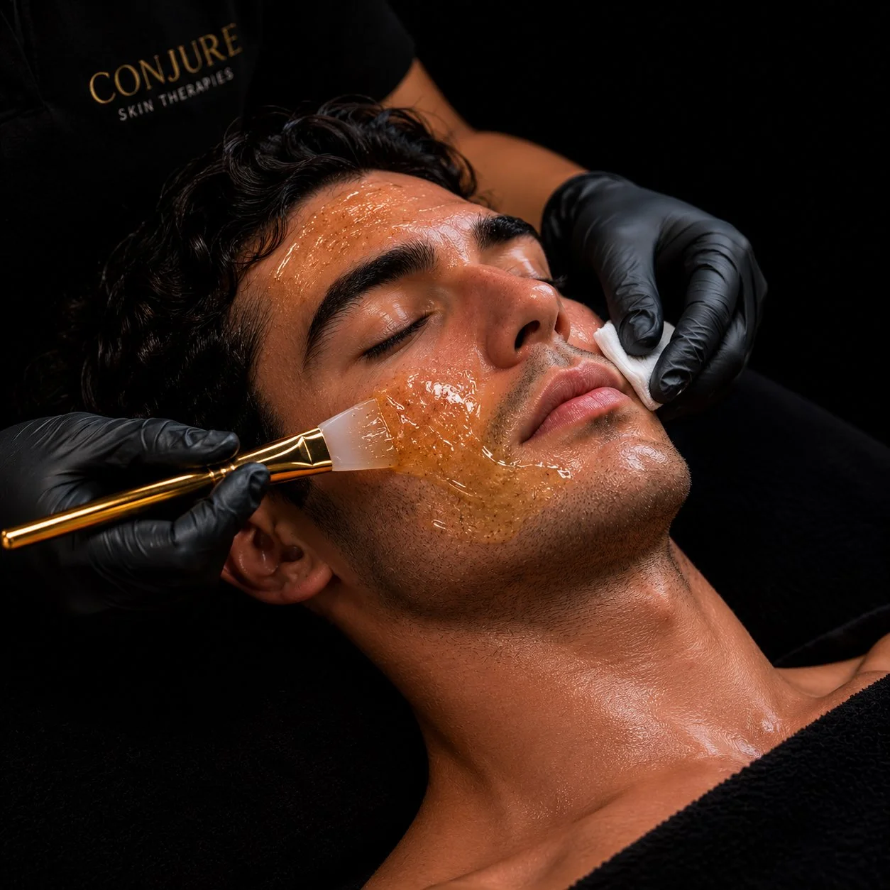 Esthetician customizing a facial treatment for a client's skin type in San Diego