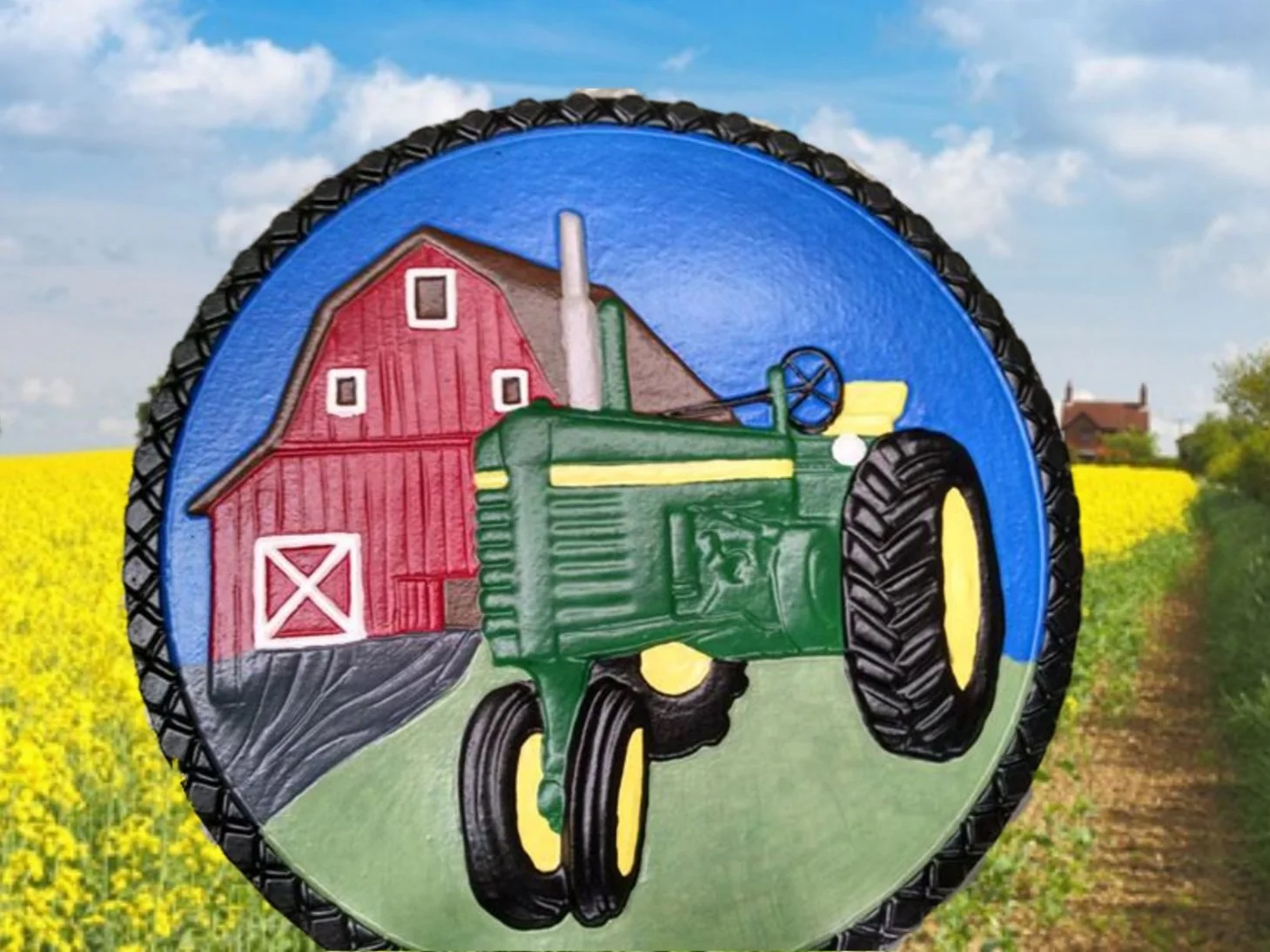 stepping stone with tractor and barn scene on it