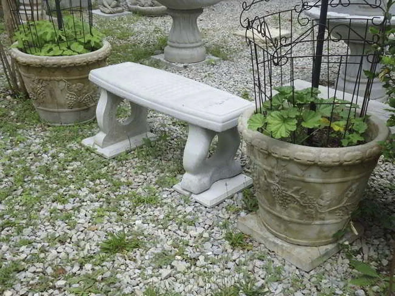 Checkers bench in plain concrete setting in a garden.jpg