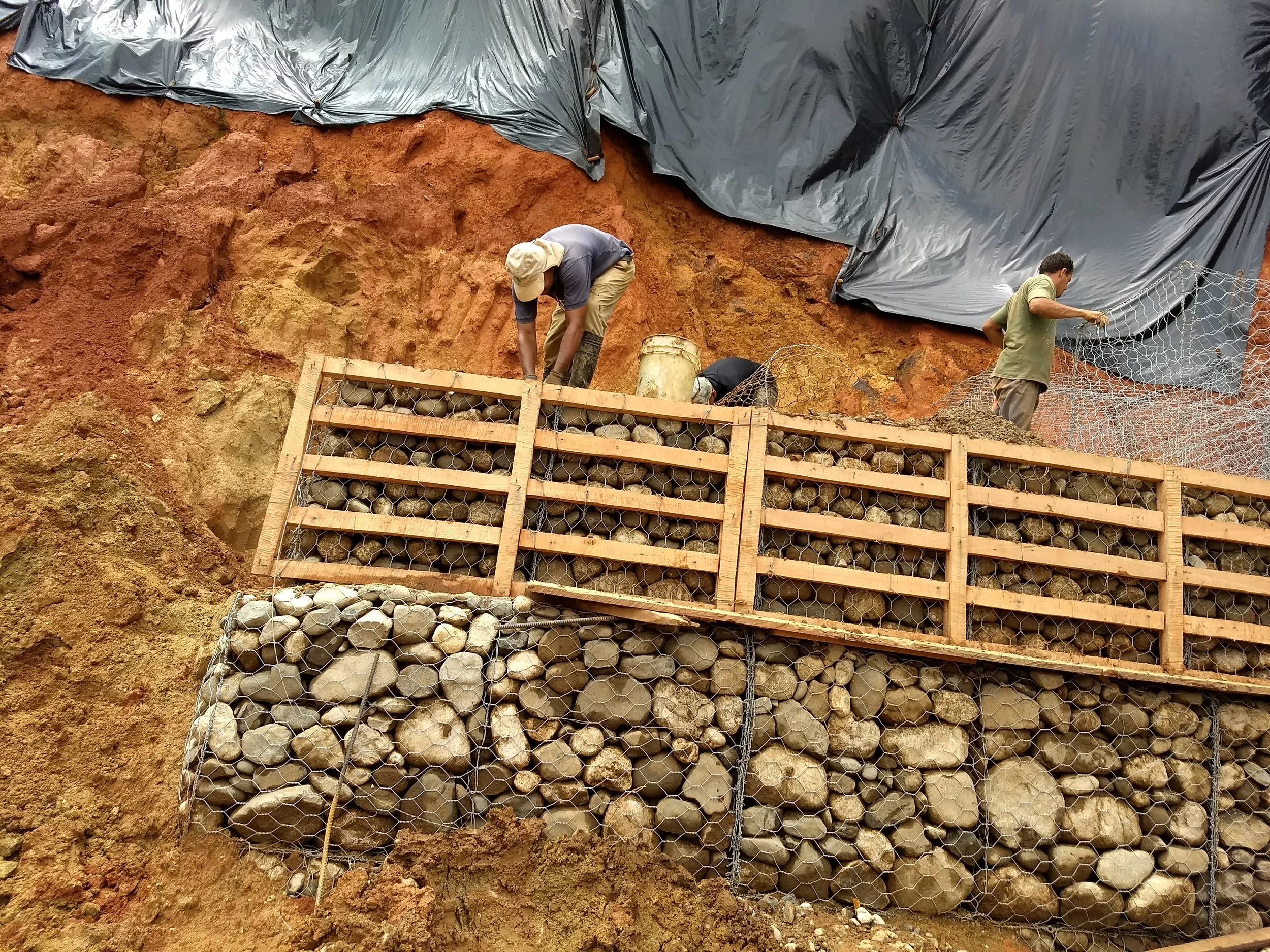 The base of the gavion. They have filled about 40 baskets by hand so far. 130 still to go.