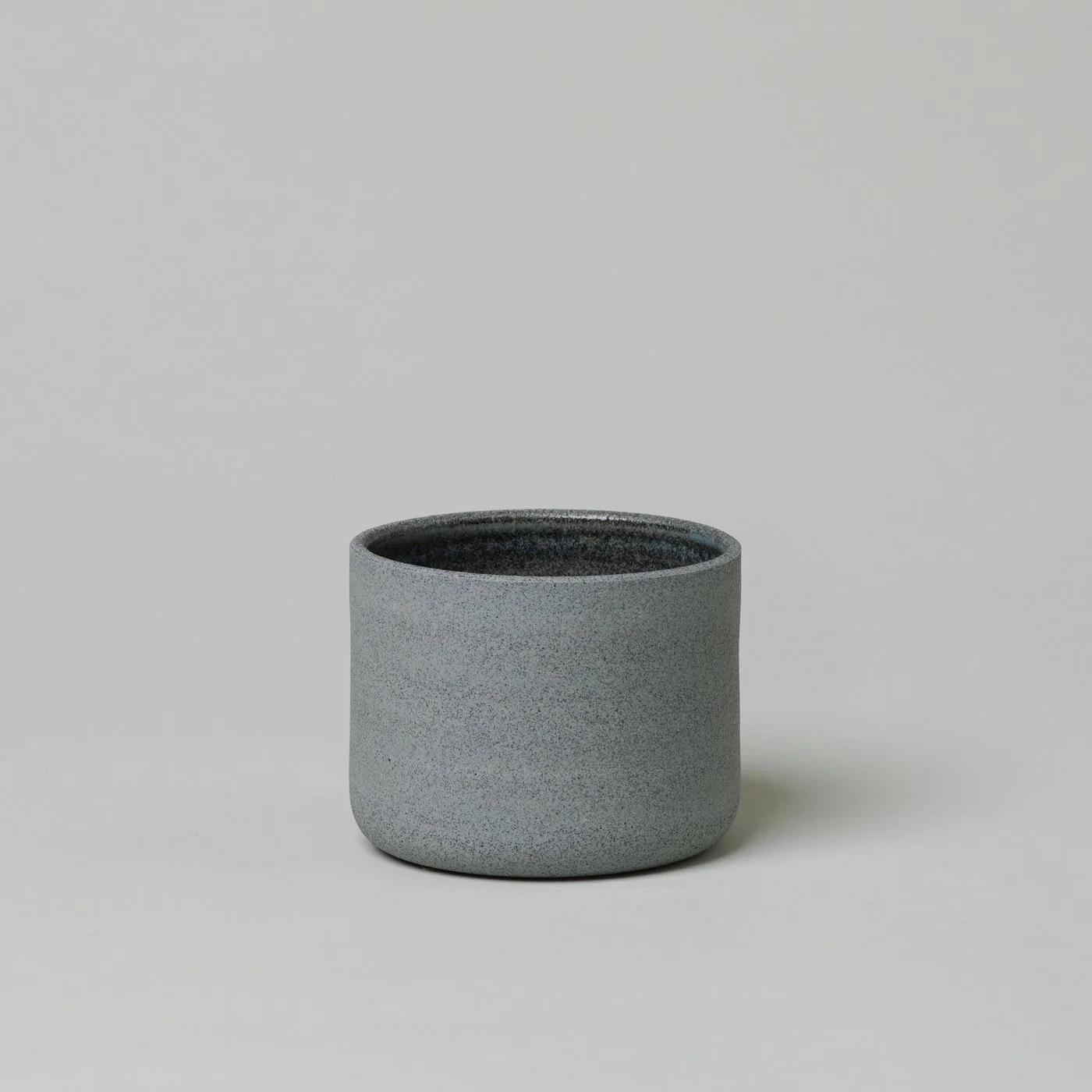 product image of a textured slate grey, minimally designed, handmade cup