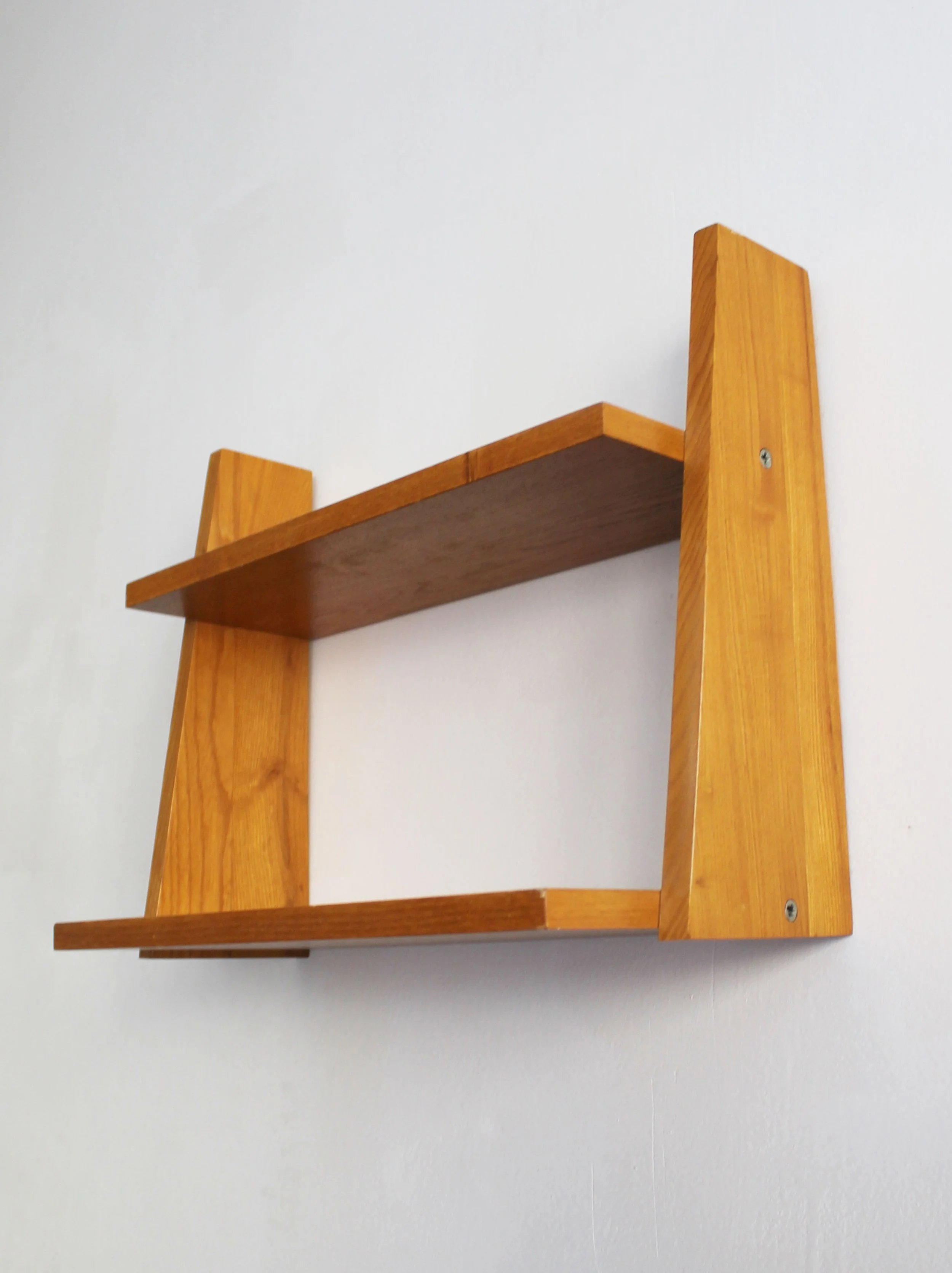 Side view of 1960s Czechoslovak beech wall shelf showing its angular geometric profile