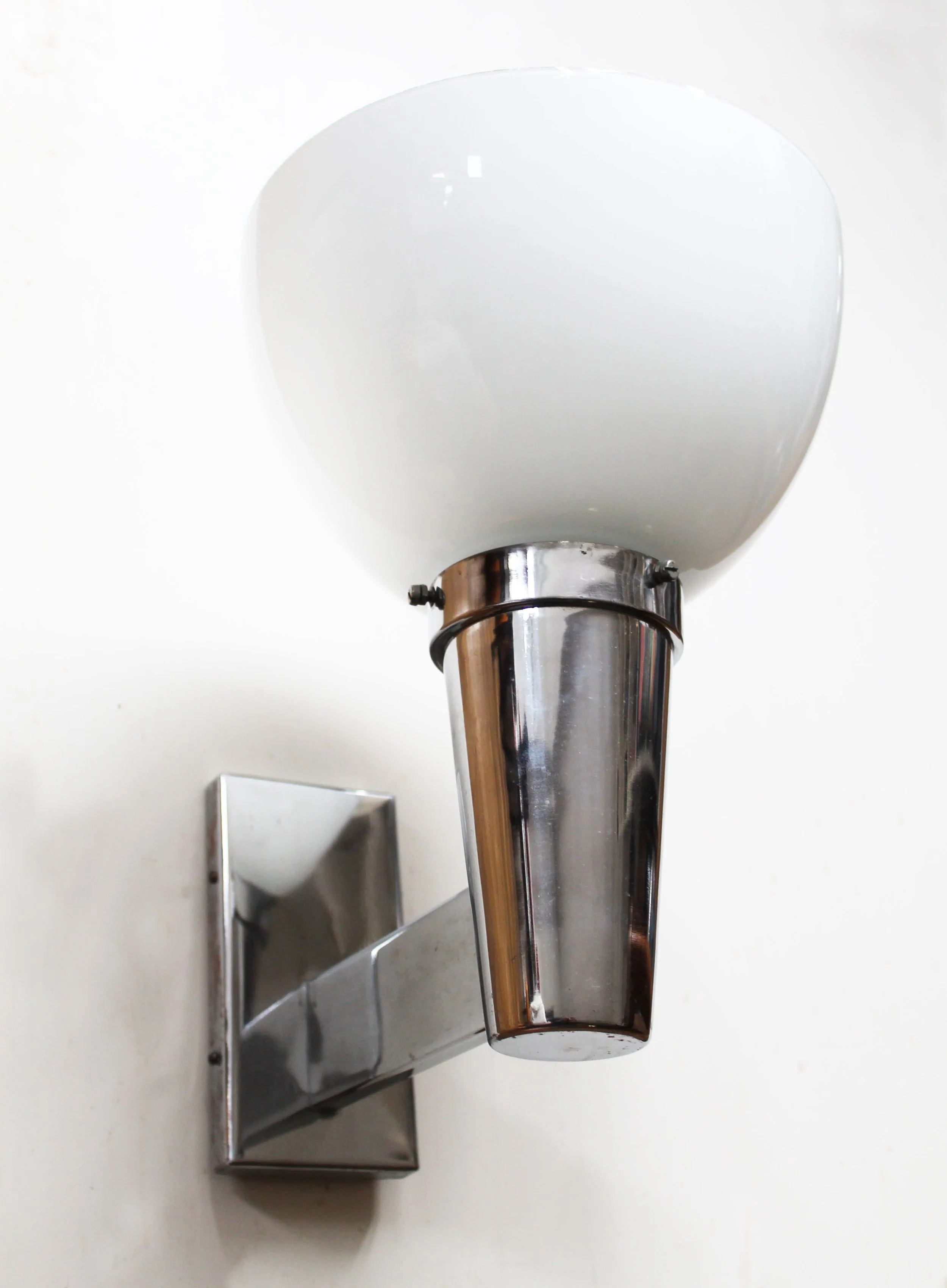 Rear view of Napako wall light showing rectangular wall-mount plate and screws.jpg