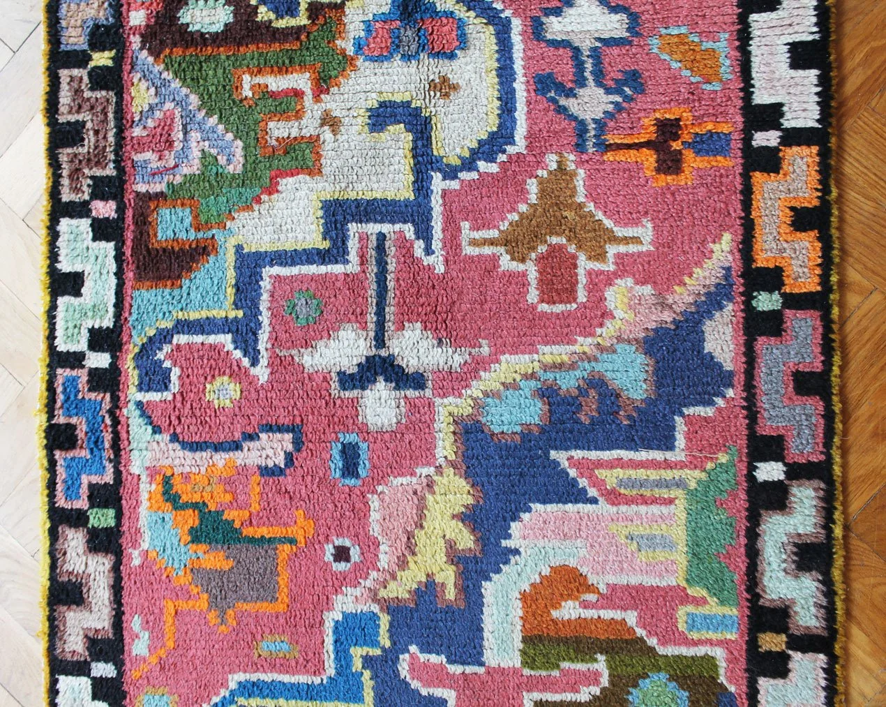 Colourful mid-century wool rug with stepped border design.jpg
