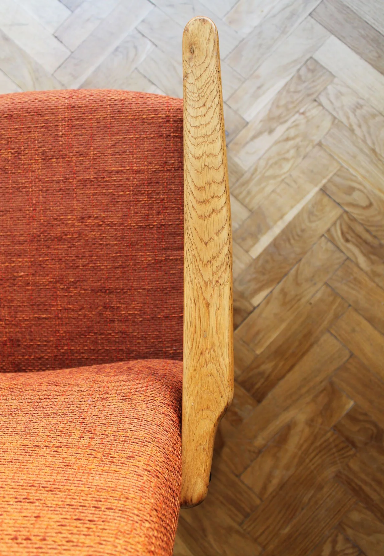 Detail of new upholstery and natural wood tones in restored chair.jpg