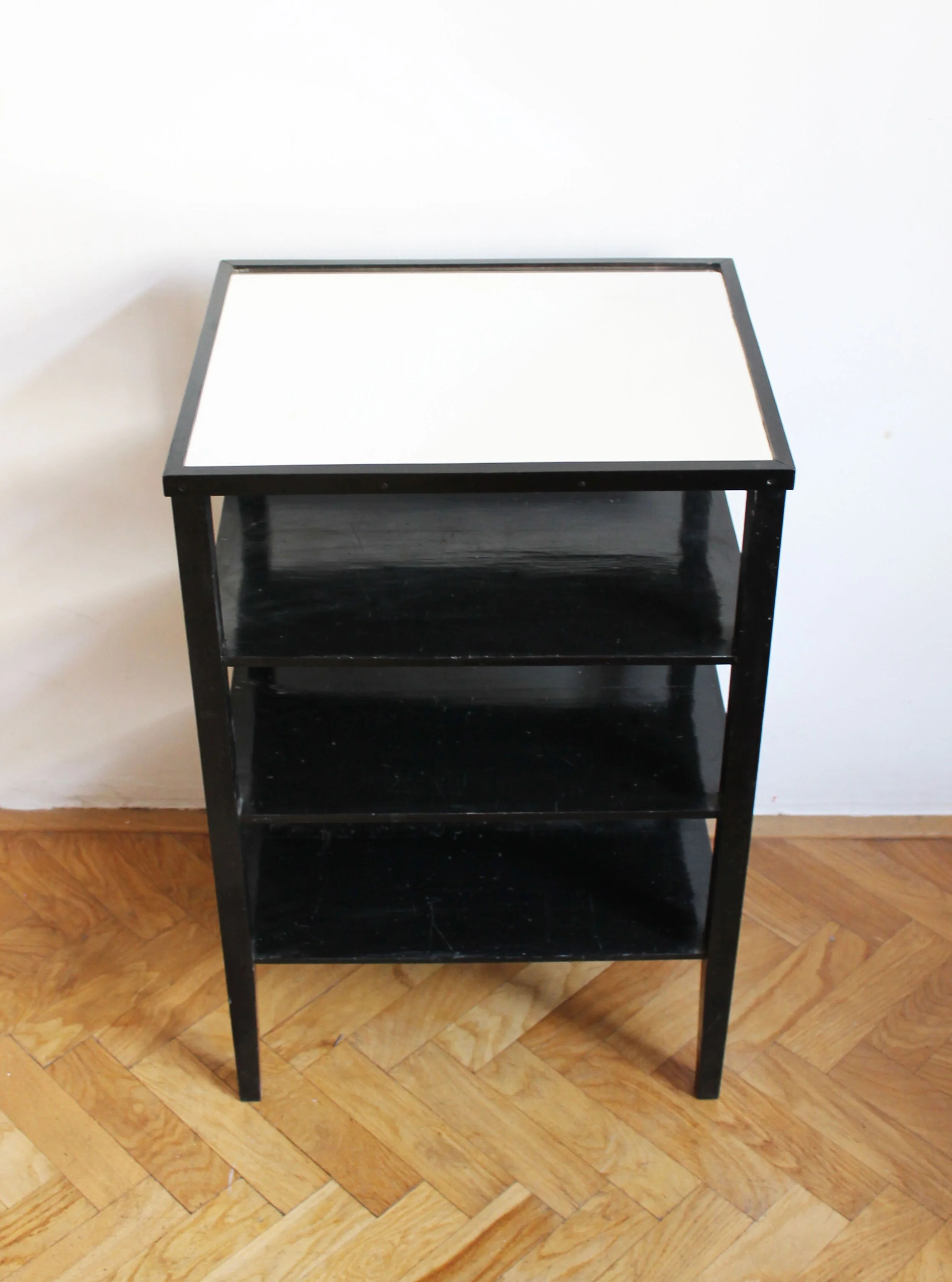 Vintage Czechoslovak side table showing rectangular bevelled glass top and open Modernist shelving.jpg