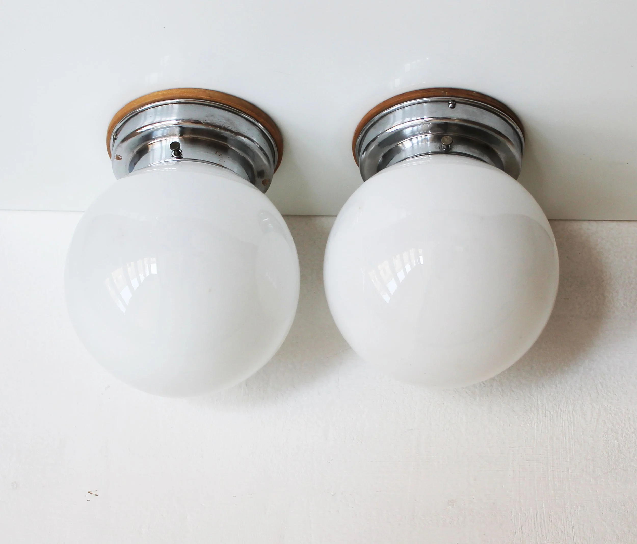 1930s functionalist wall lamp with milk glass sphere.jpg