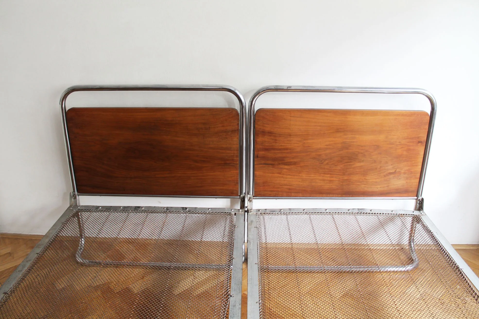 Modernist beds with wooden headboards.jpg