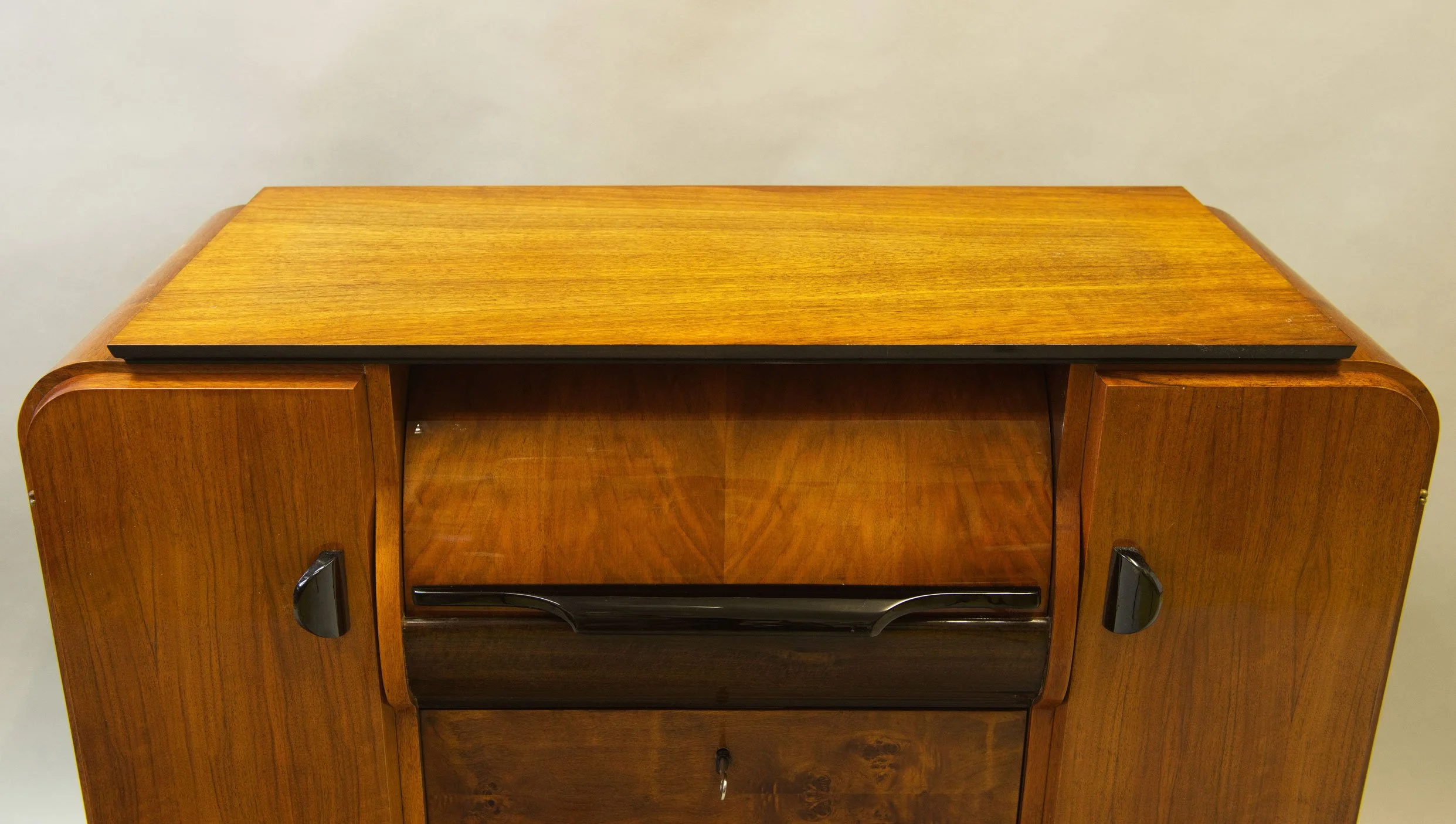Vintage Halabala record cabinet showing sculptural side profile.jpg