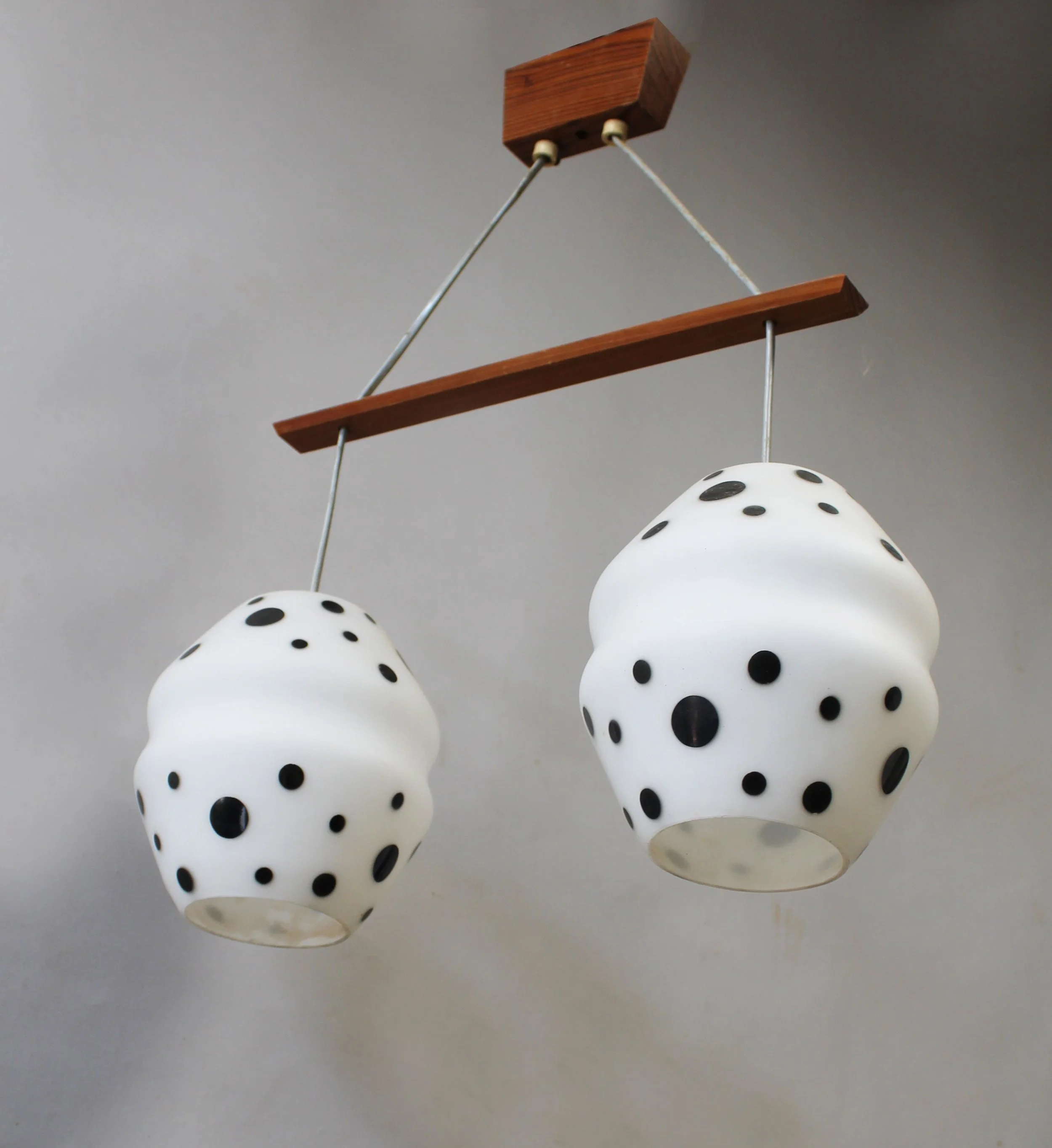 Detail of black spotted opaline glass shade on vintage Czechoslovak ceiling light