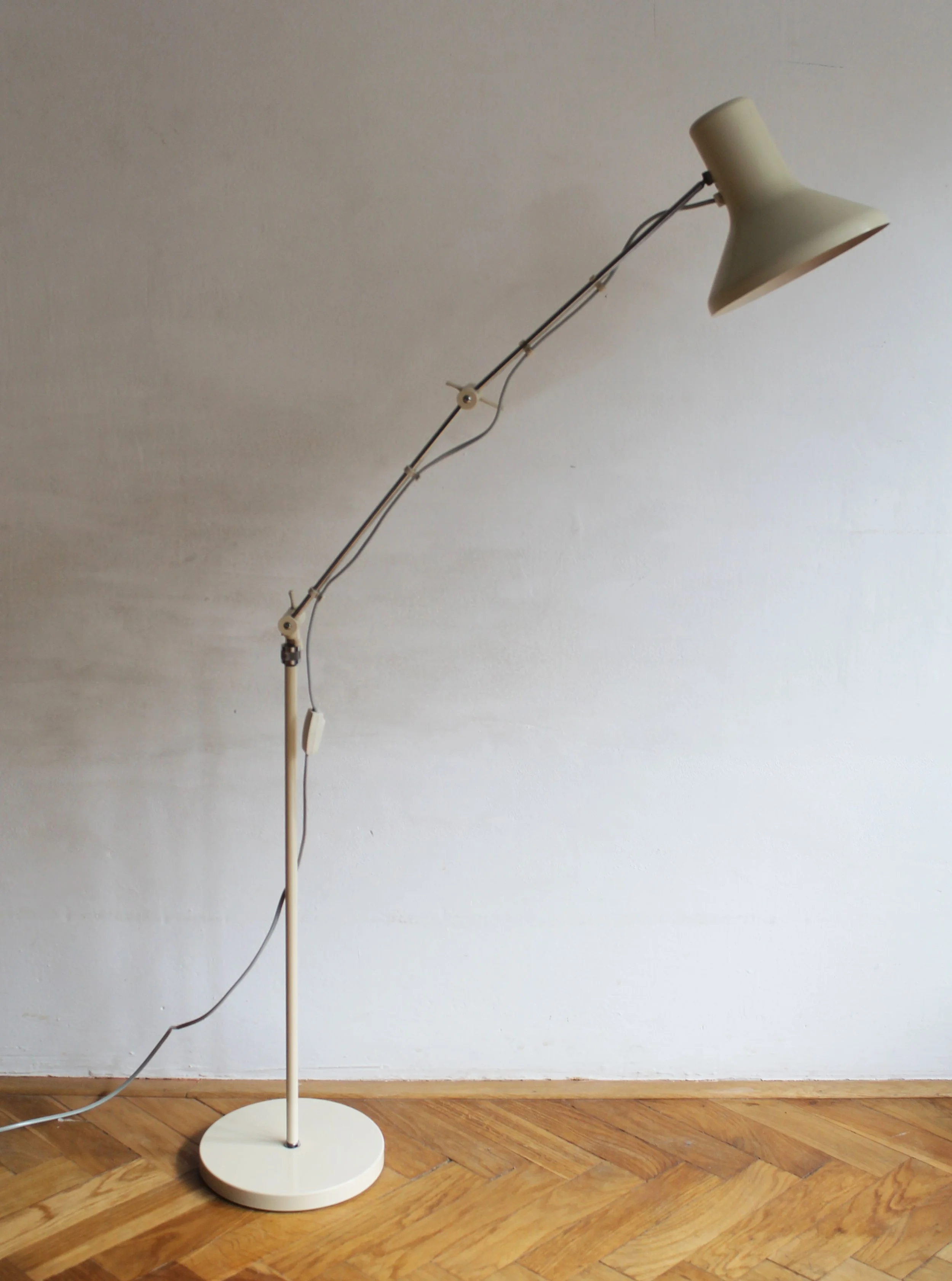 View of lamp head angled downward, showing articulation