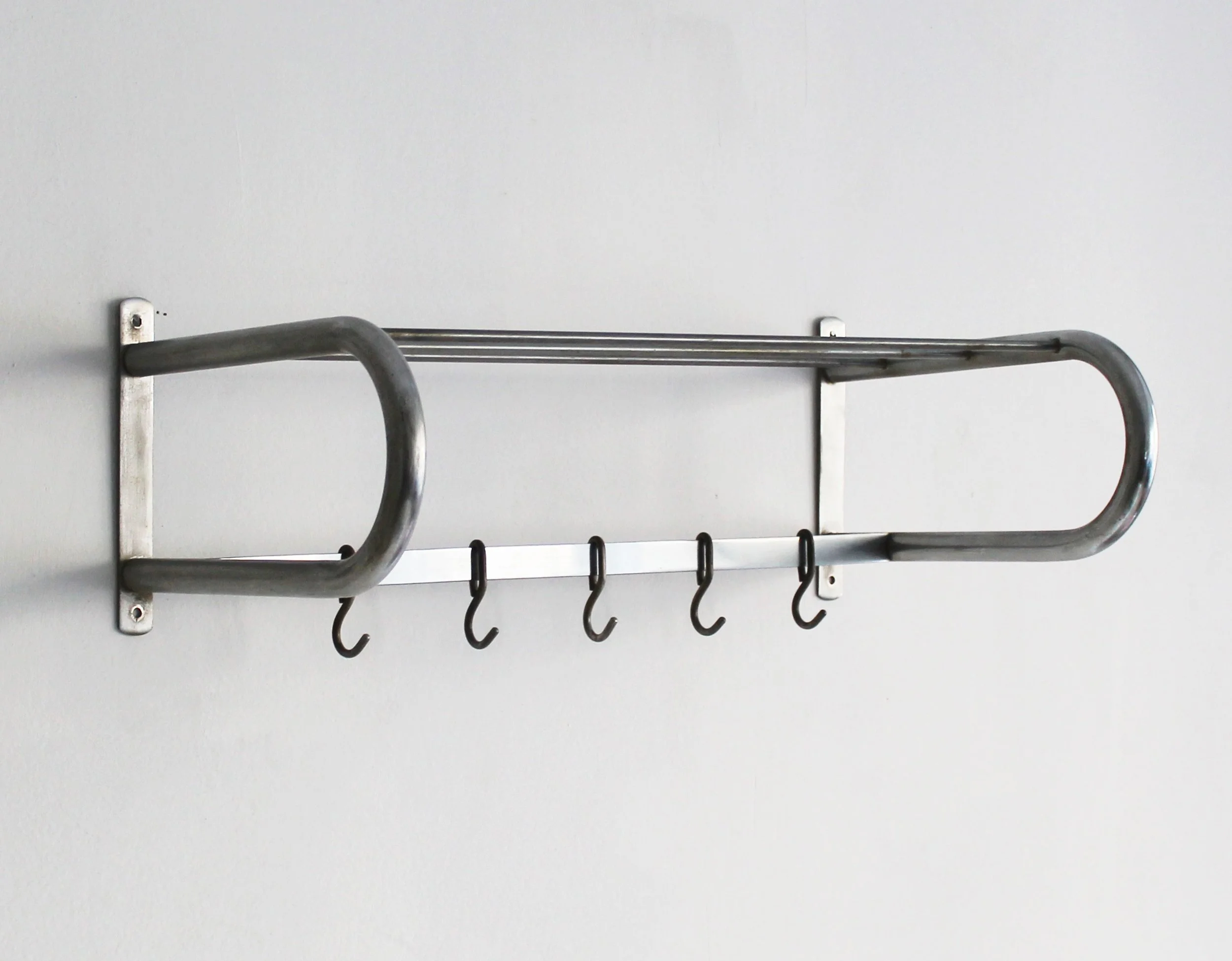 Modernist wall-mounted tubular steel coat rack from Czechoslovakia offered by By Barnabas.jpg
