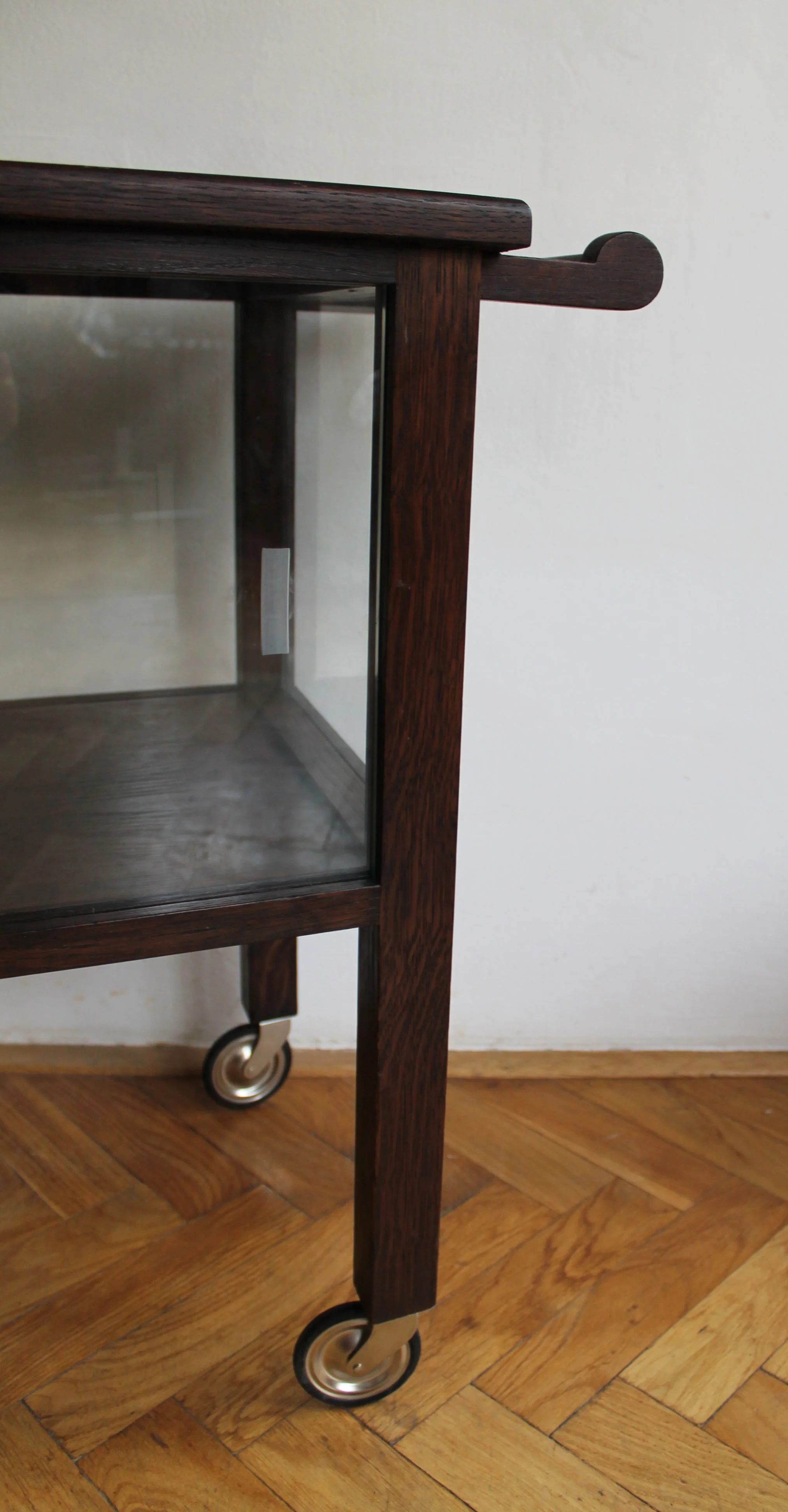 Close-up of wooden wheel frame and metal casters.jpg