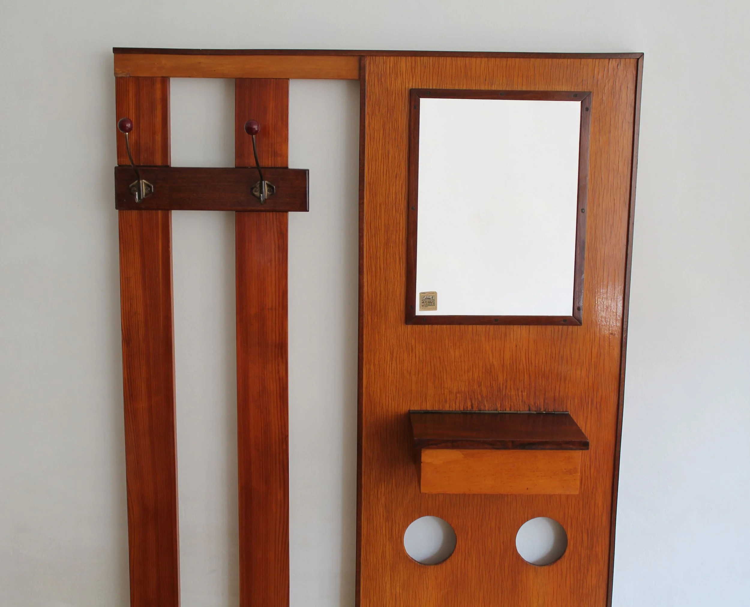 Vintage wall-mounted rack with mirror, storage box and playful hole motif.jpg (Copy)