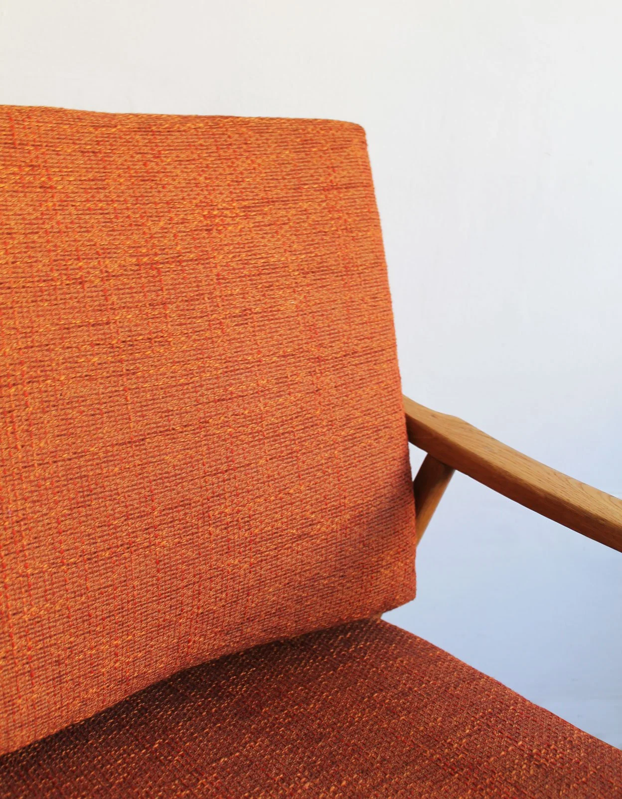 Vintage armchair highlighting blend of comfort and sculptural design.jpg