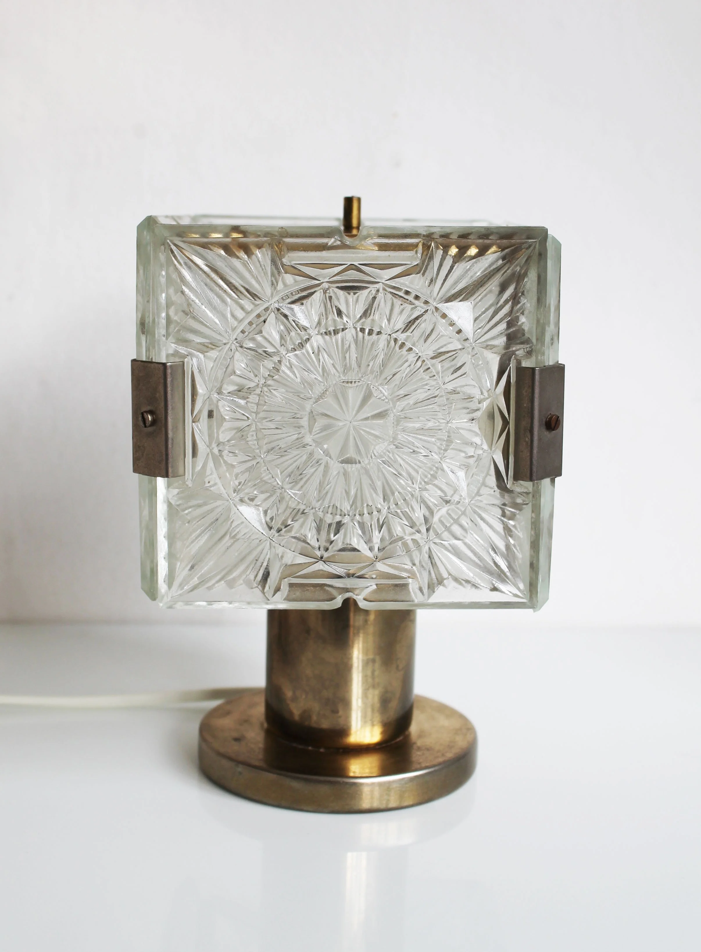 Vintage crystal lamp highlighting structured glass reflections.jpg