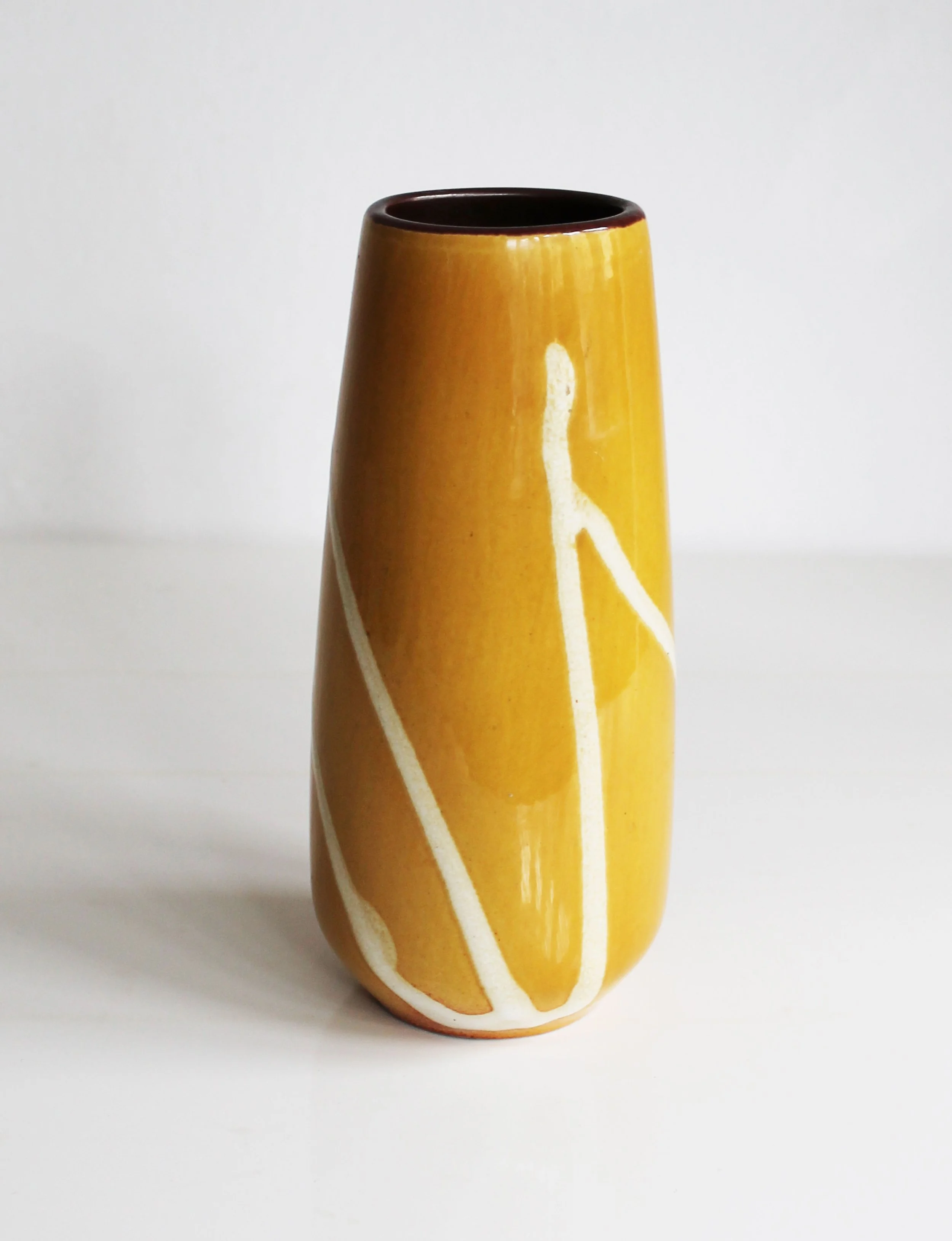 Side profile of vintage 1960s porcelain vase showing geometric silhouette.jpg